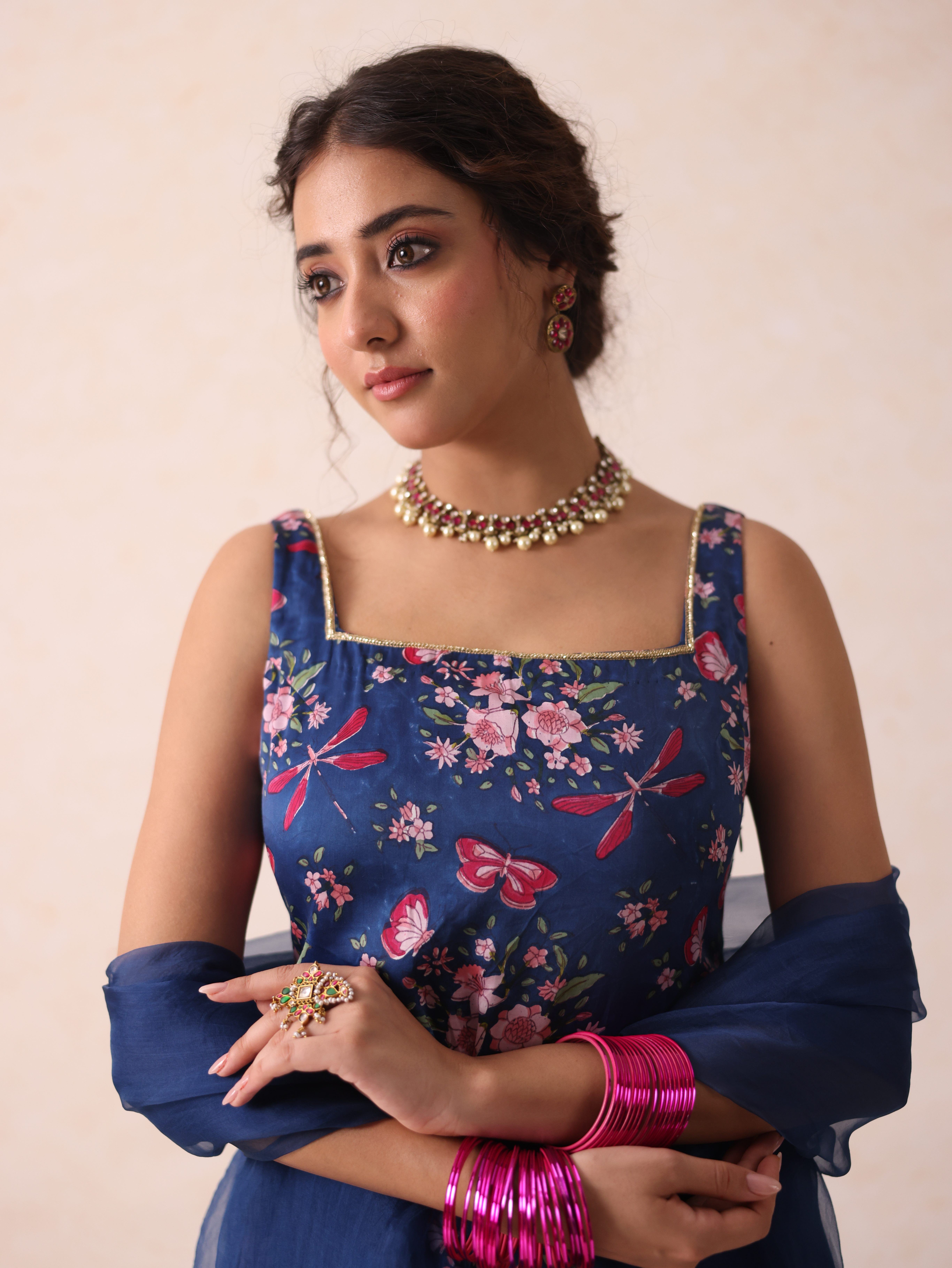 A model showcasing Jaya Blue Sharara by Gaamya from Gaamya's collection