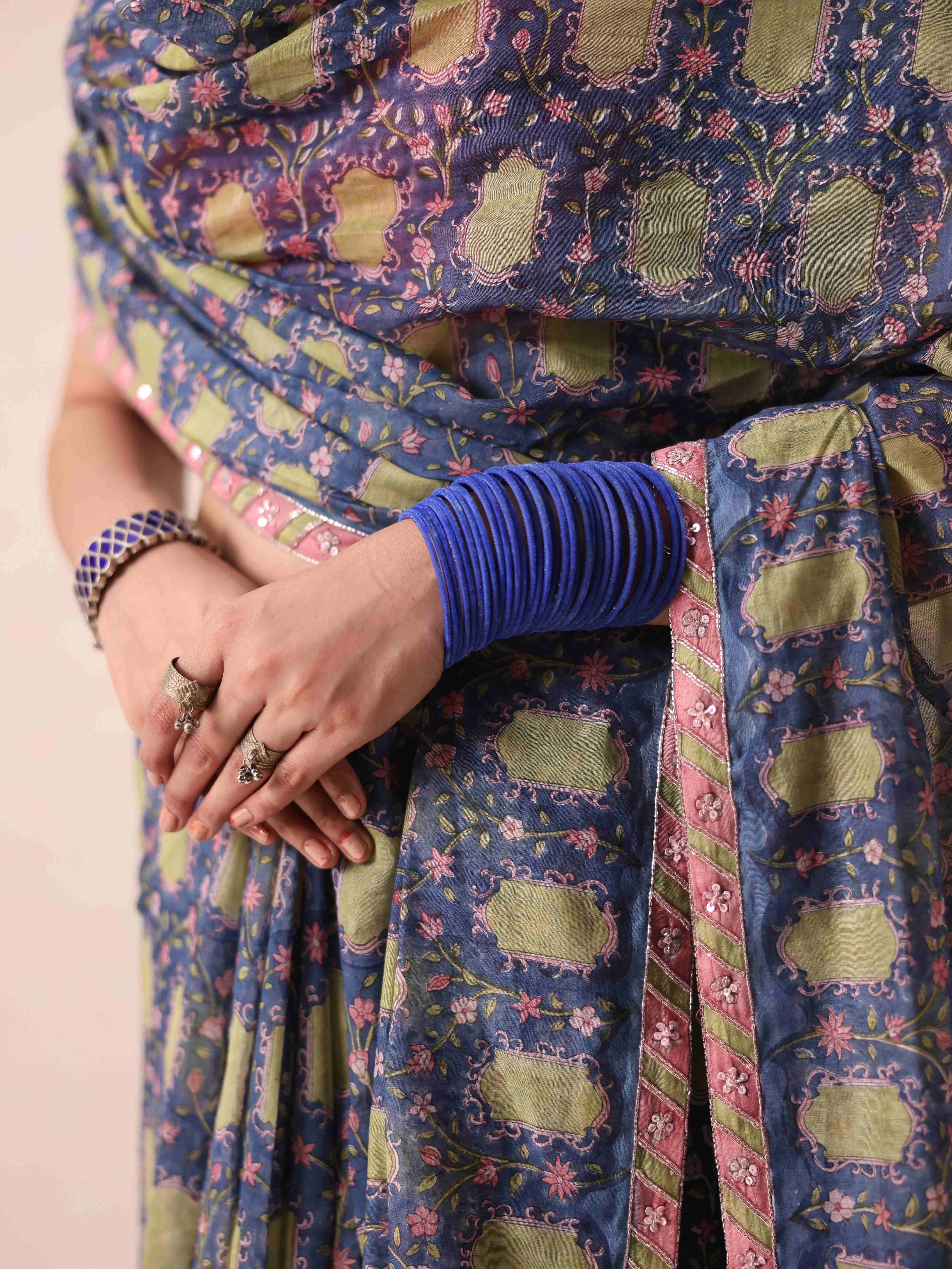 A model showcasing Tanya Blue Saree by Gaamya from Gaamya's collection