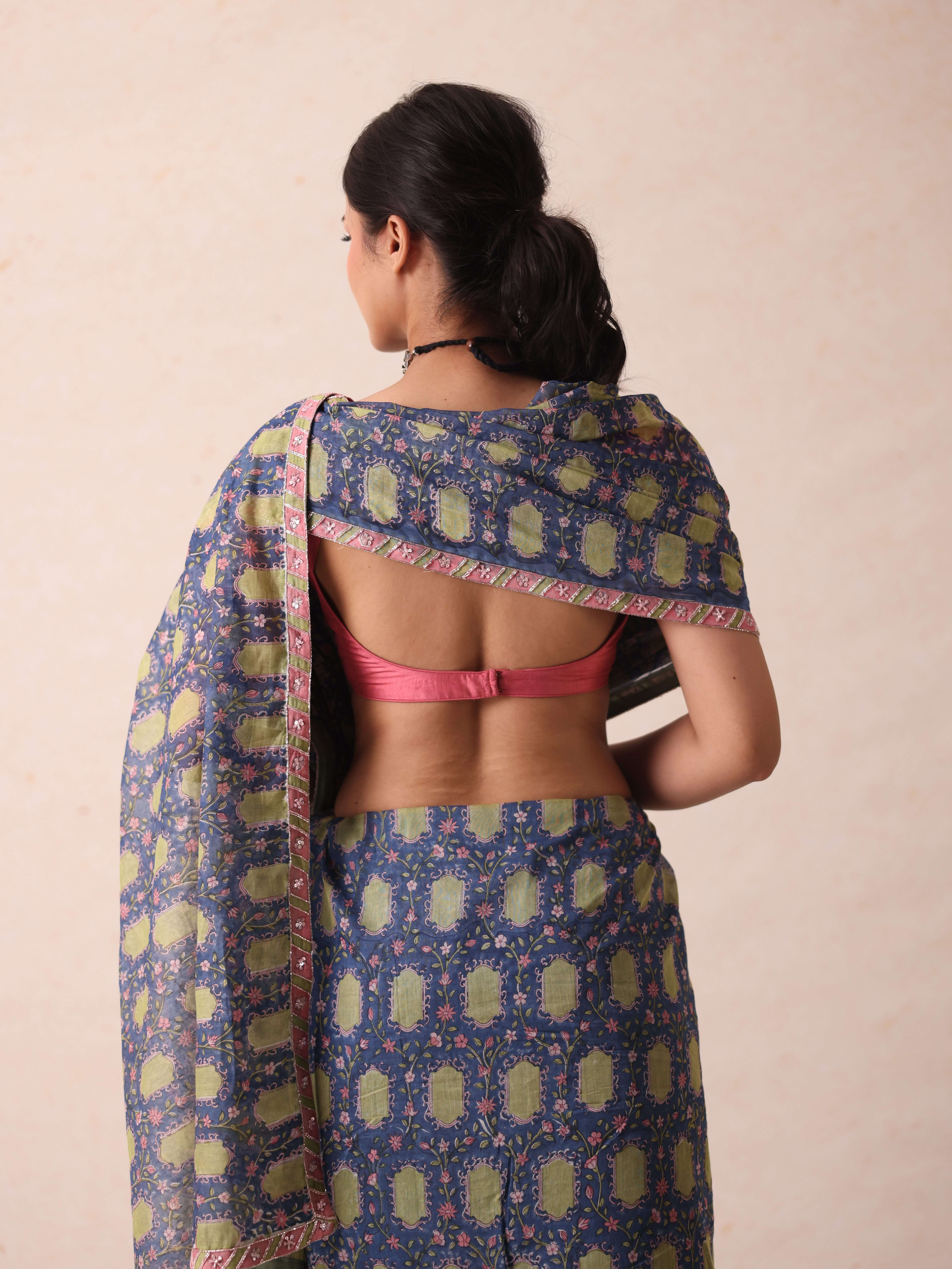 A model showcasing Tanya Blue Saree by Gaamya from Gaamya's collection