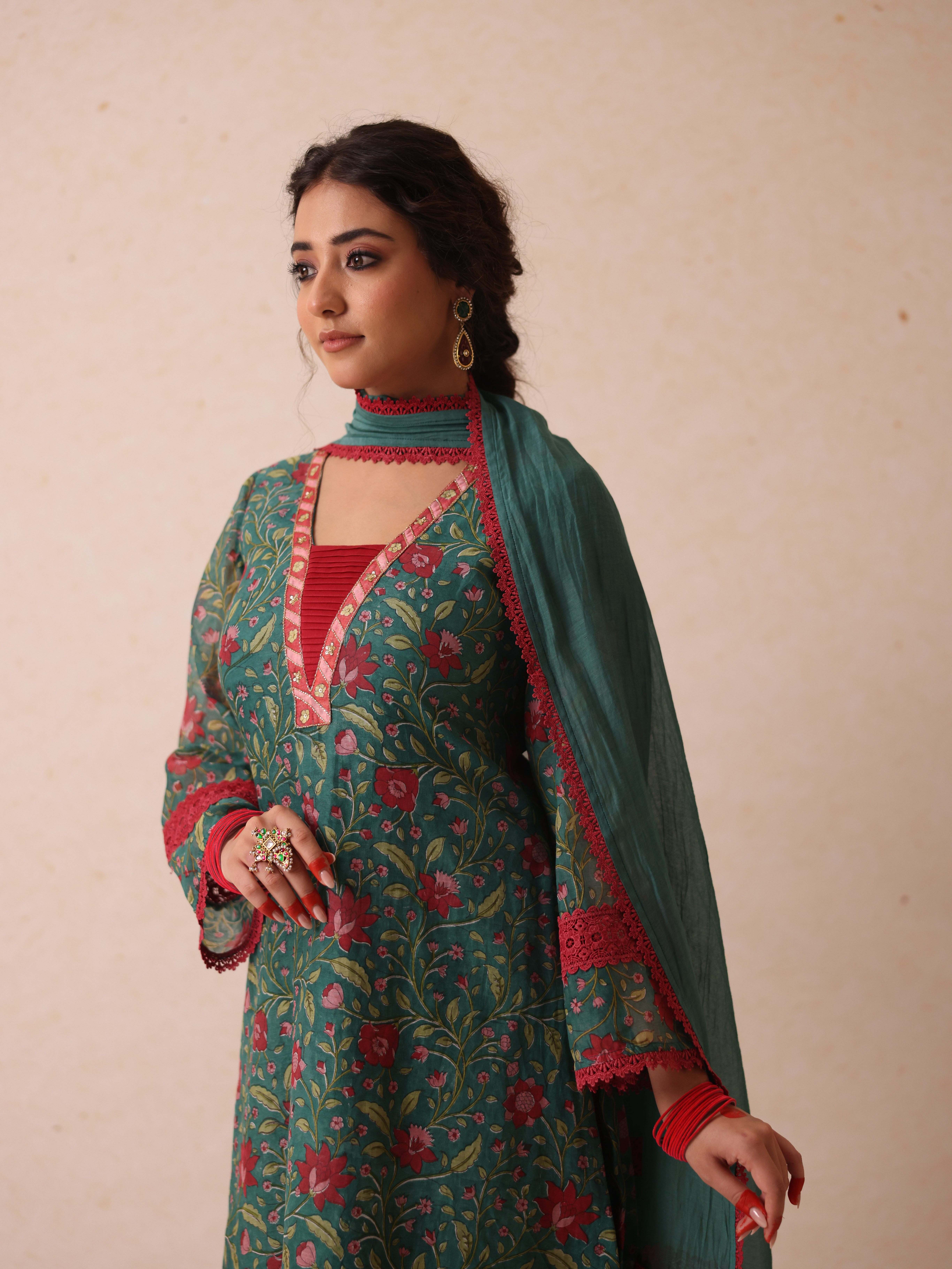 A model showcasing Chetna Green Suit by Gaamya from Gaamya's collection