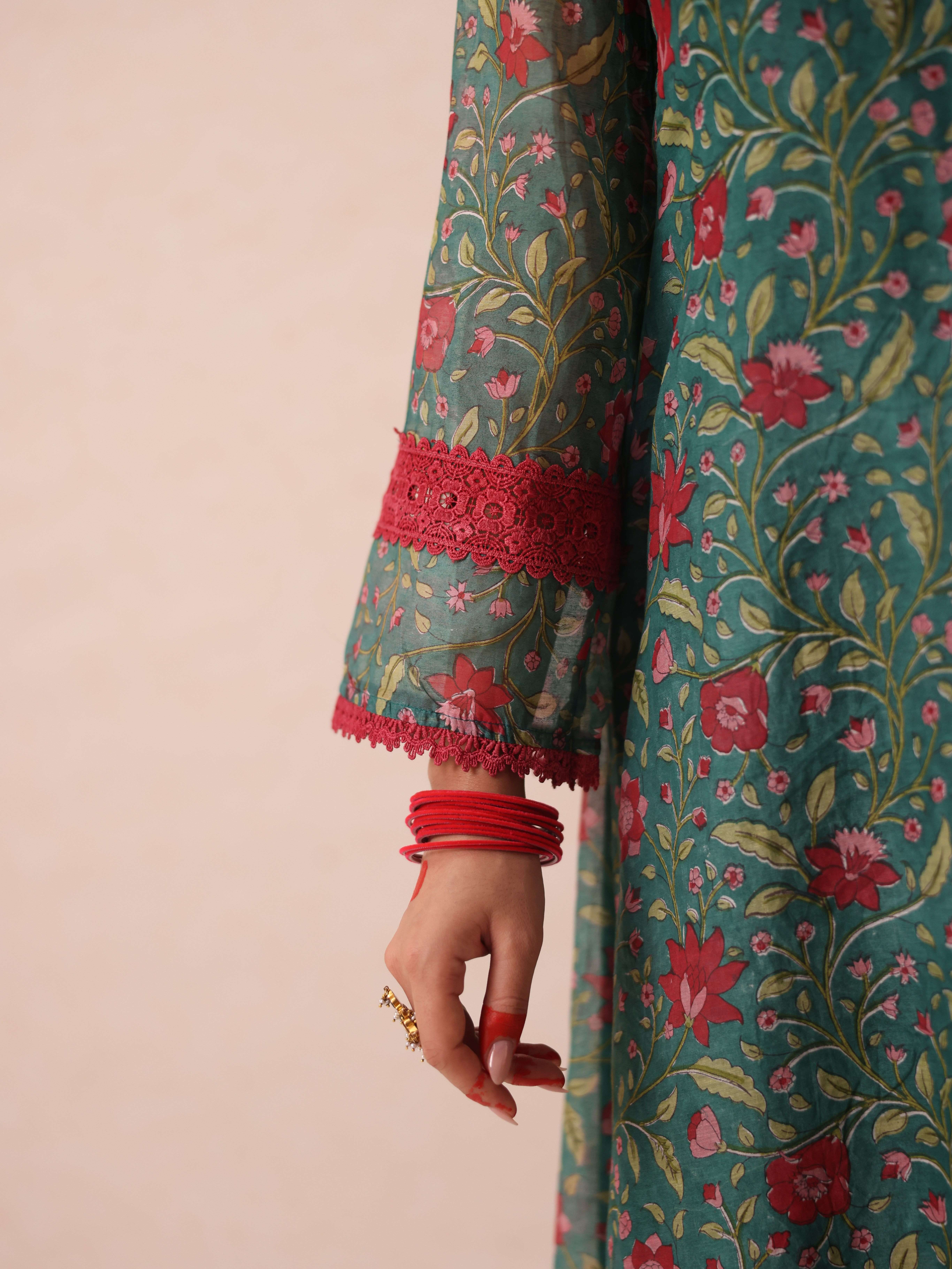 A model showcasing Chetna Green Suit by Gaamya from Gaamya's collection