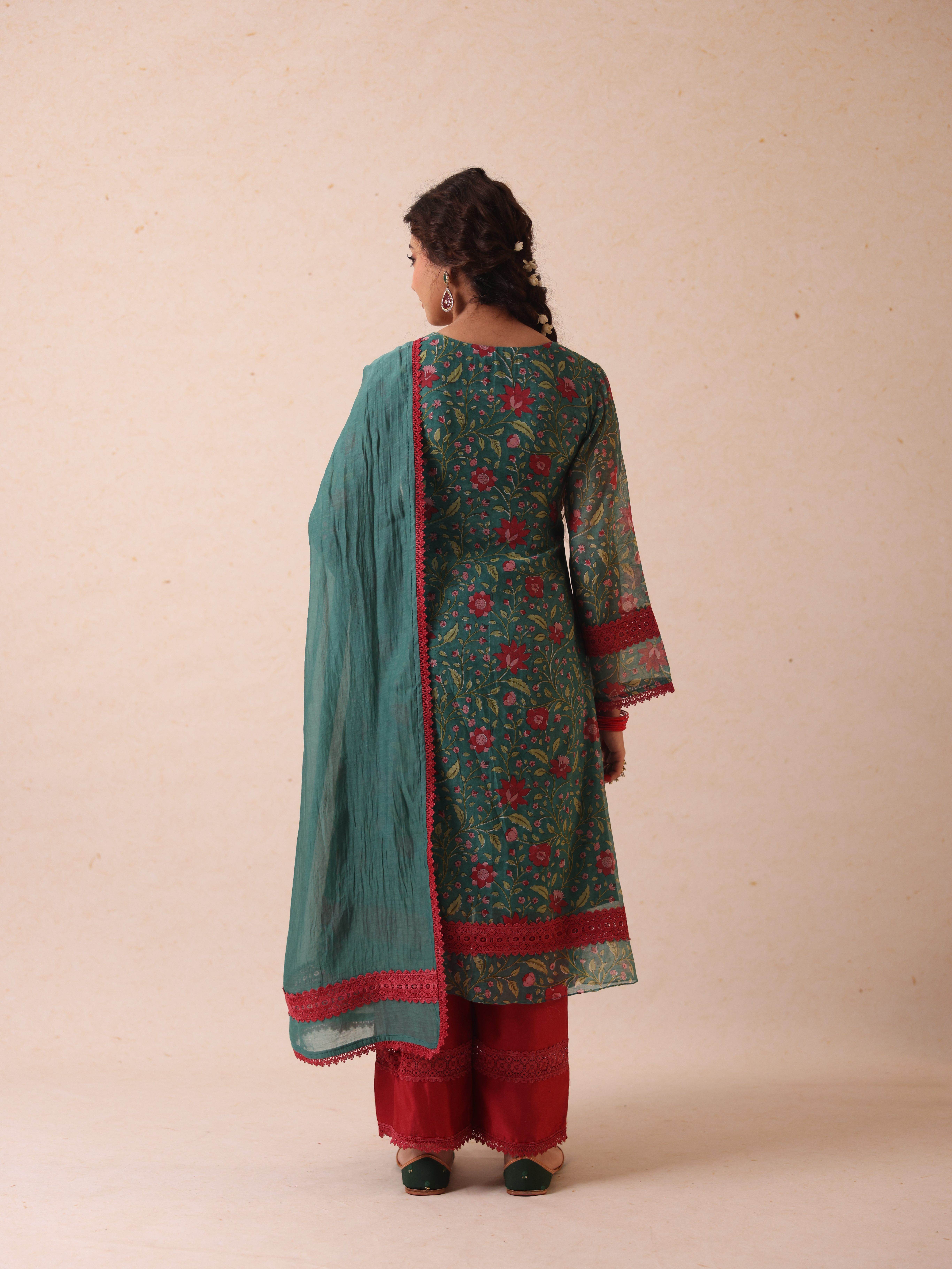 A model showcasing Chetna Green Suit by Gaamya from Gaamya's collection