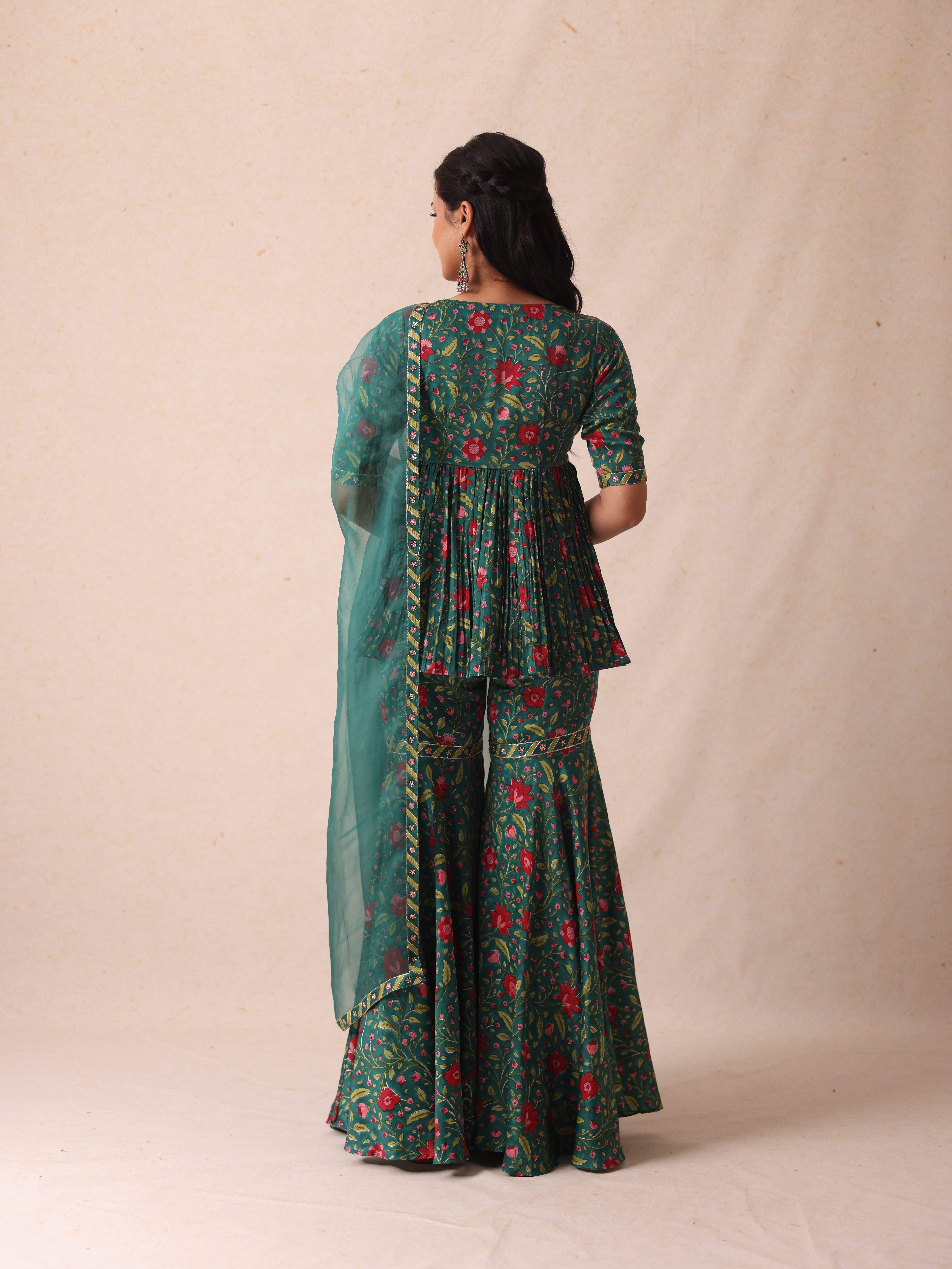 A model showcasing Sonia Green Sharara by Gaamya from Gaamya's collection A model showcasing Sonia Green Sharara by Gaamya from Gaamya's collection