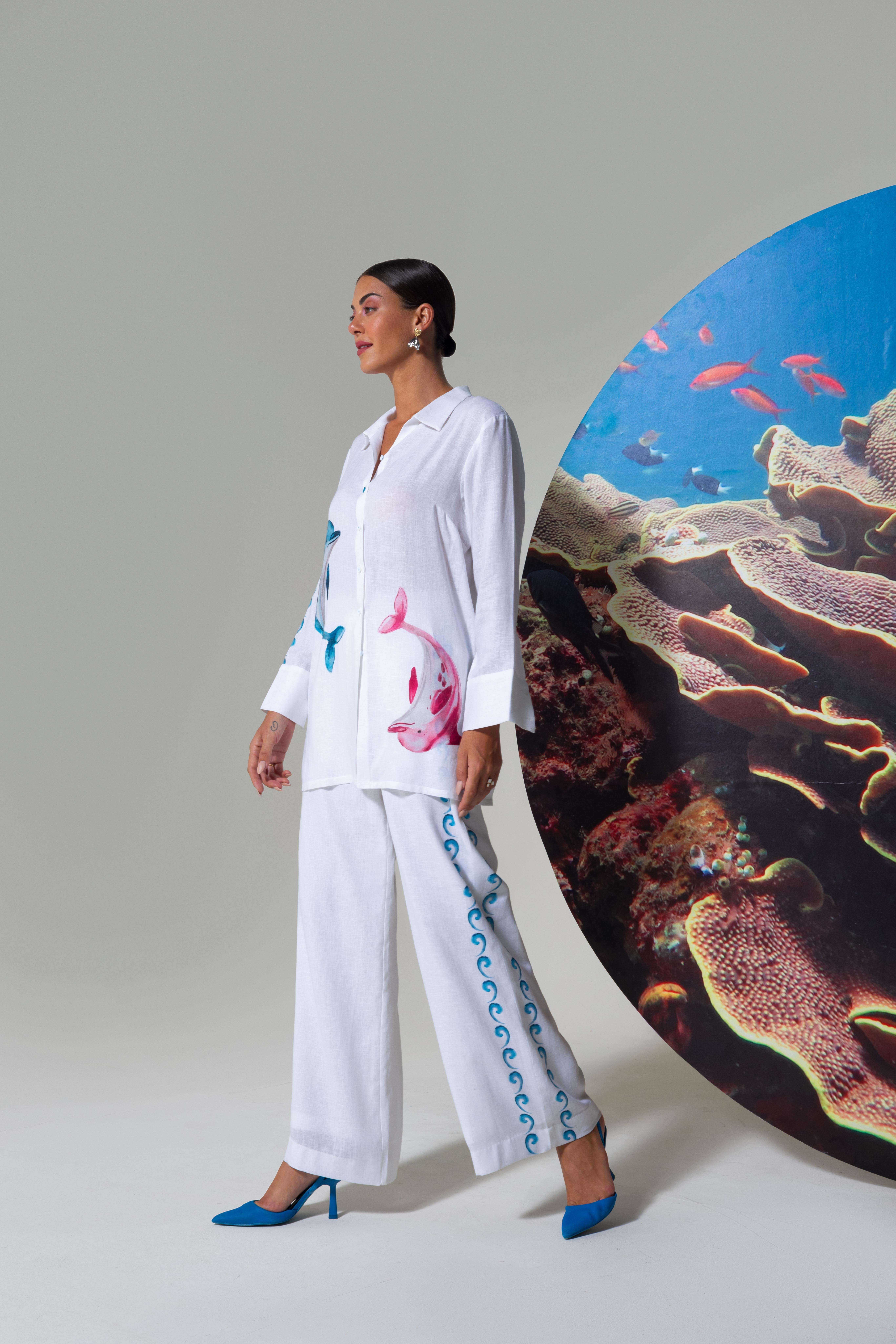 A model showcasing White Vacation Wear Top And Pants by Nautanky from Nautanky's collection