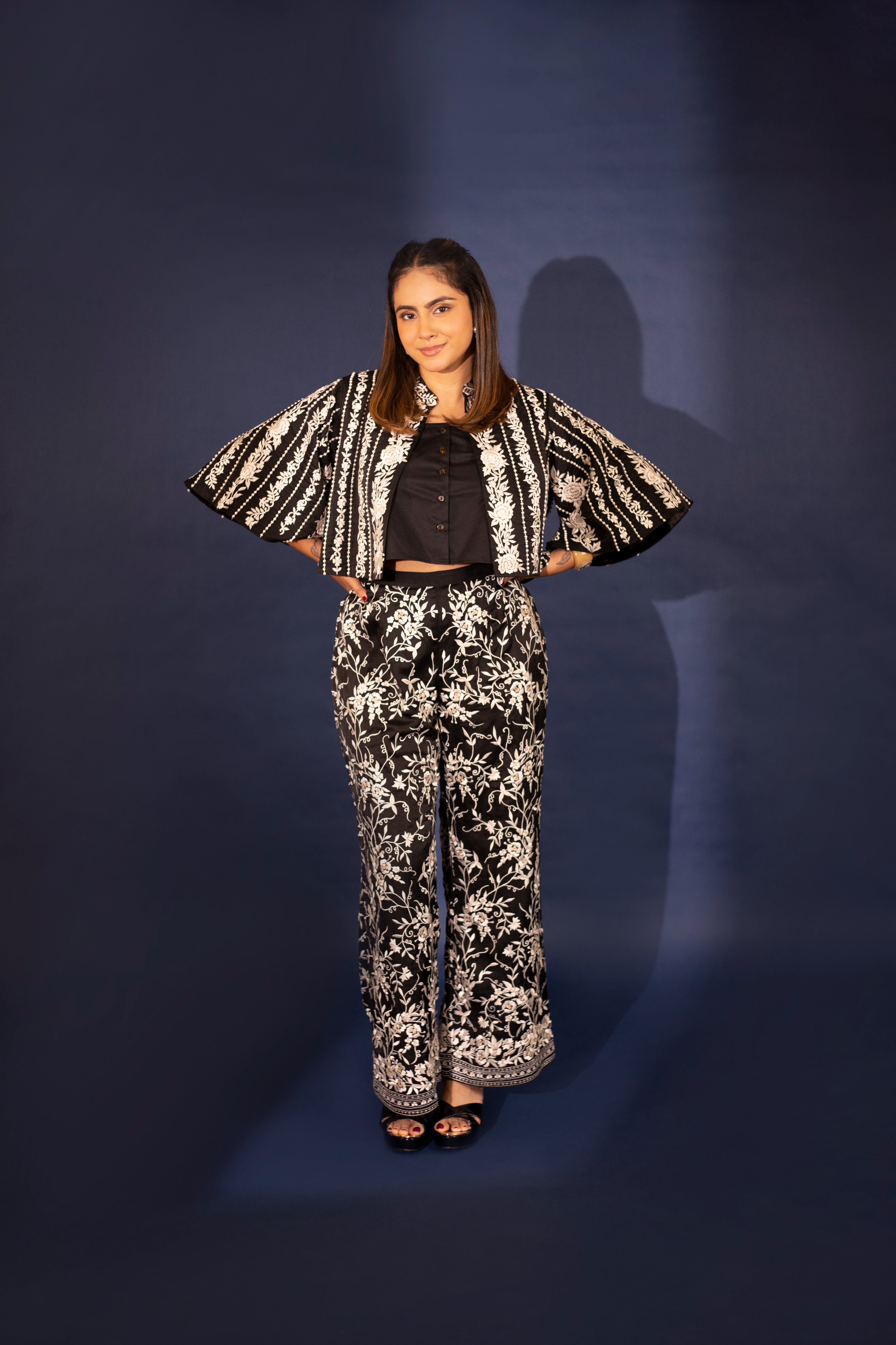 A model showcasing Noelle Black Silk Top And Pants by Ashtar from Ashtar's collection