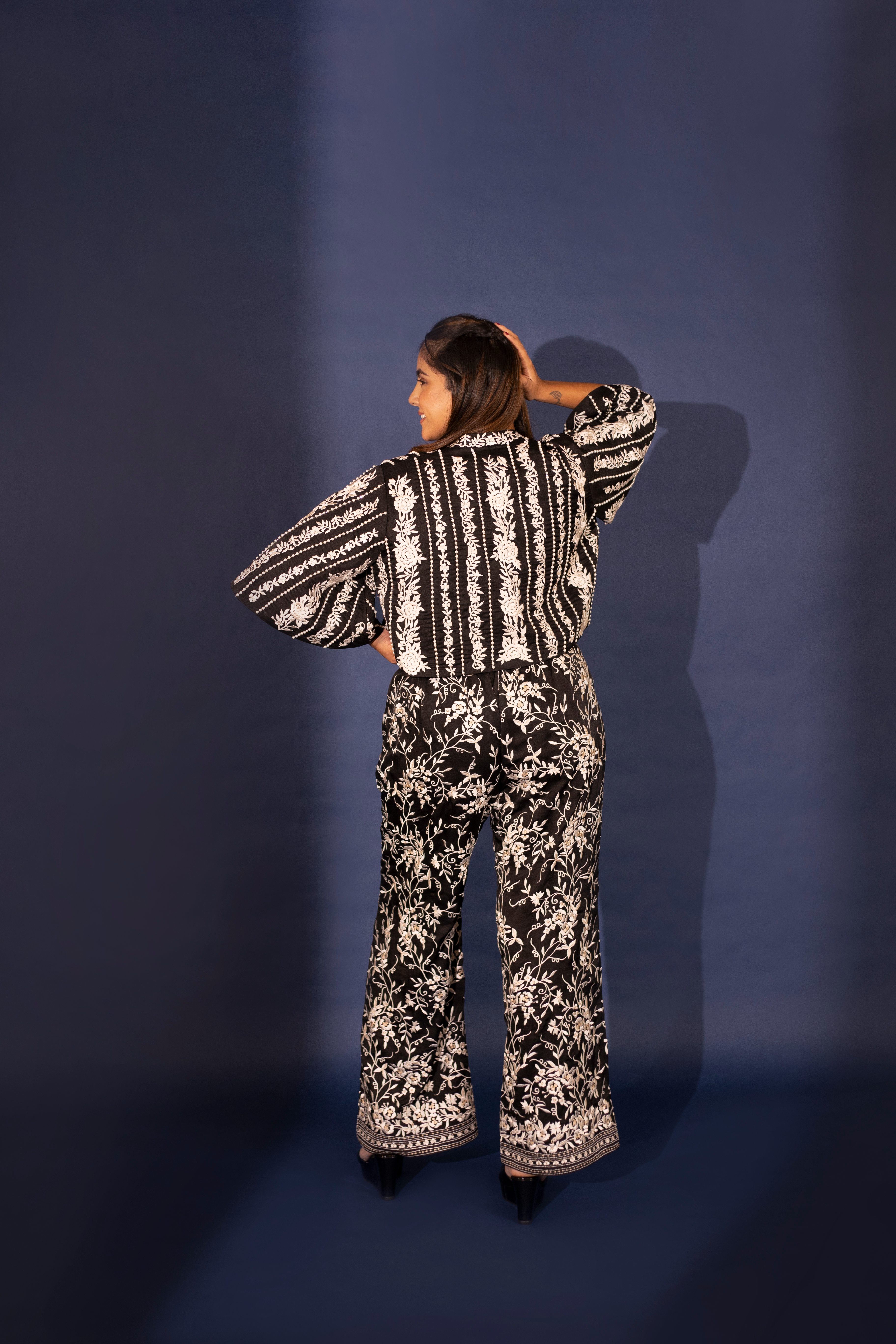 A model showcasing Noelle Black Silk Top And Pants by Ashtar from Ashtar's collection