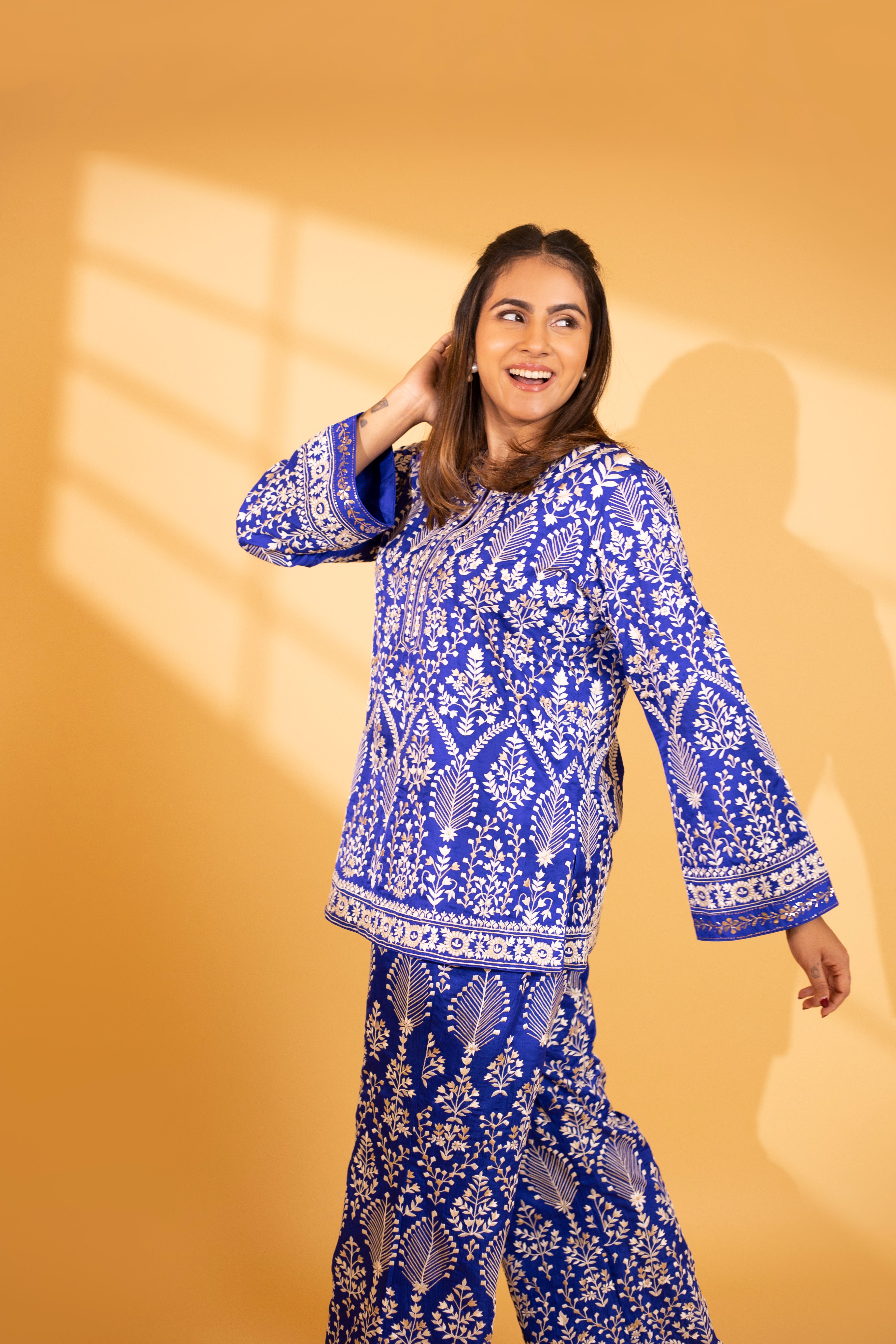 A model showcasing Celeste Regal Blue Silk Kurta And Pants by Ashtar from Ashtar's collection