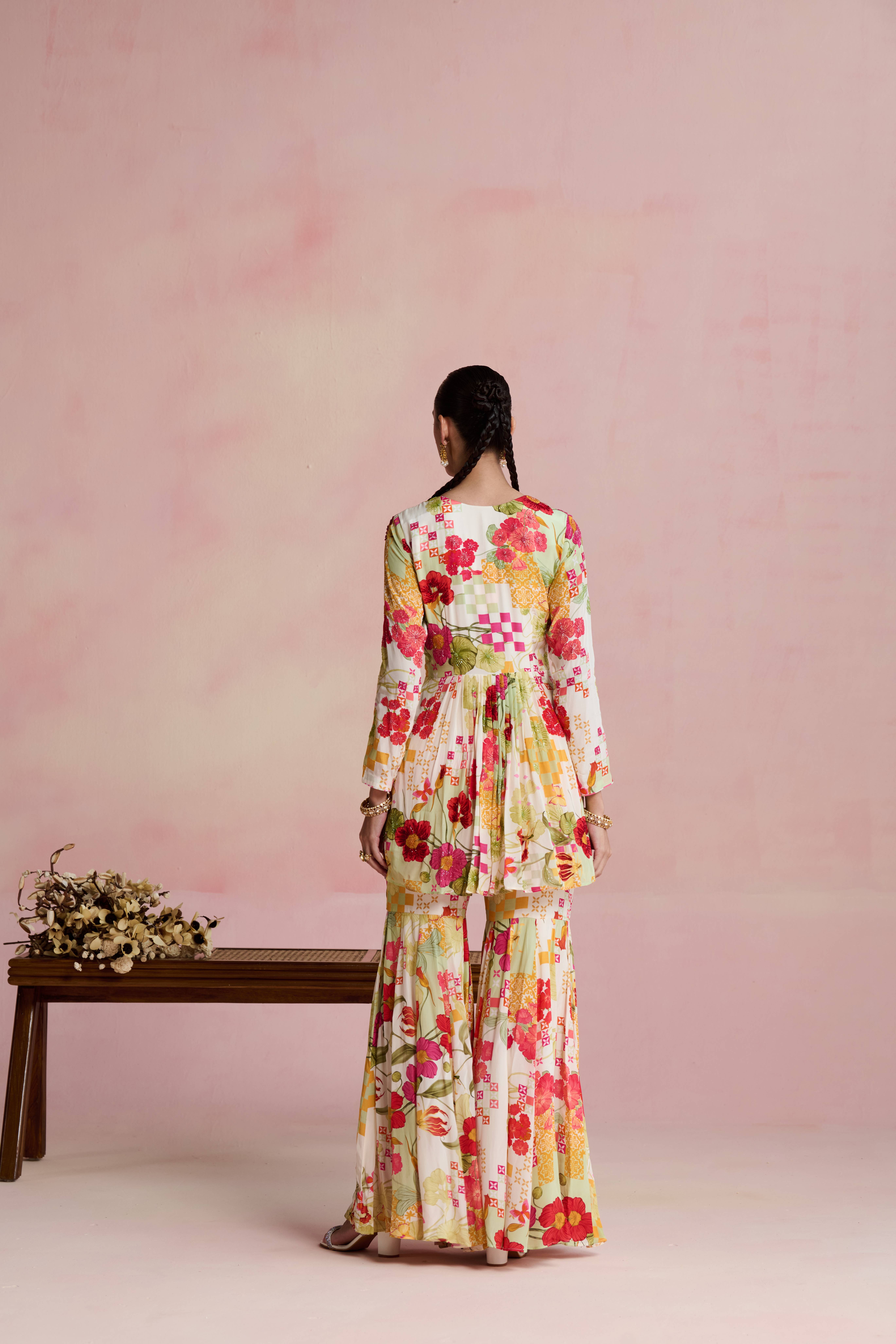 A model showcasing Roop Short Kurta Garara Set by Nirvair from Nirvair's collection A model showcasing Roop Short Kurta Garara Set by Nirvair from Nirvair's collection