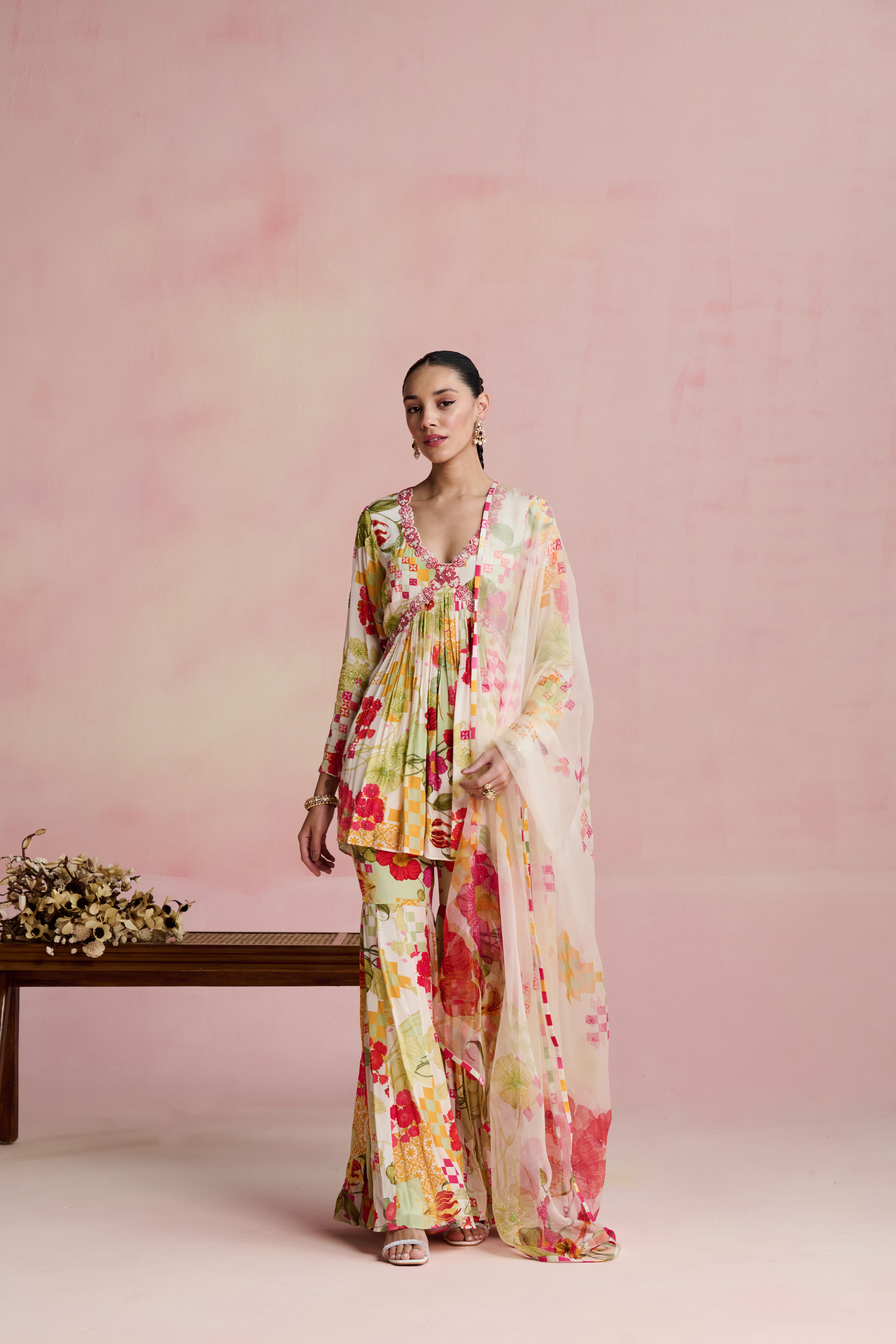 A model showcasing Roop Short Kurta Garara Set by Nirvair from Nirvair's collection A model showcasing Roop Short Kurta Garara Set by Nirvair from Nirvair's collection