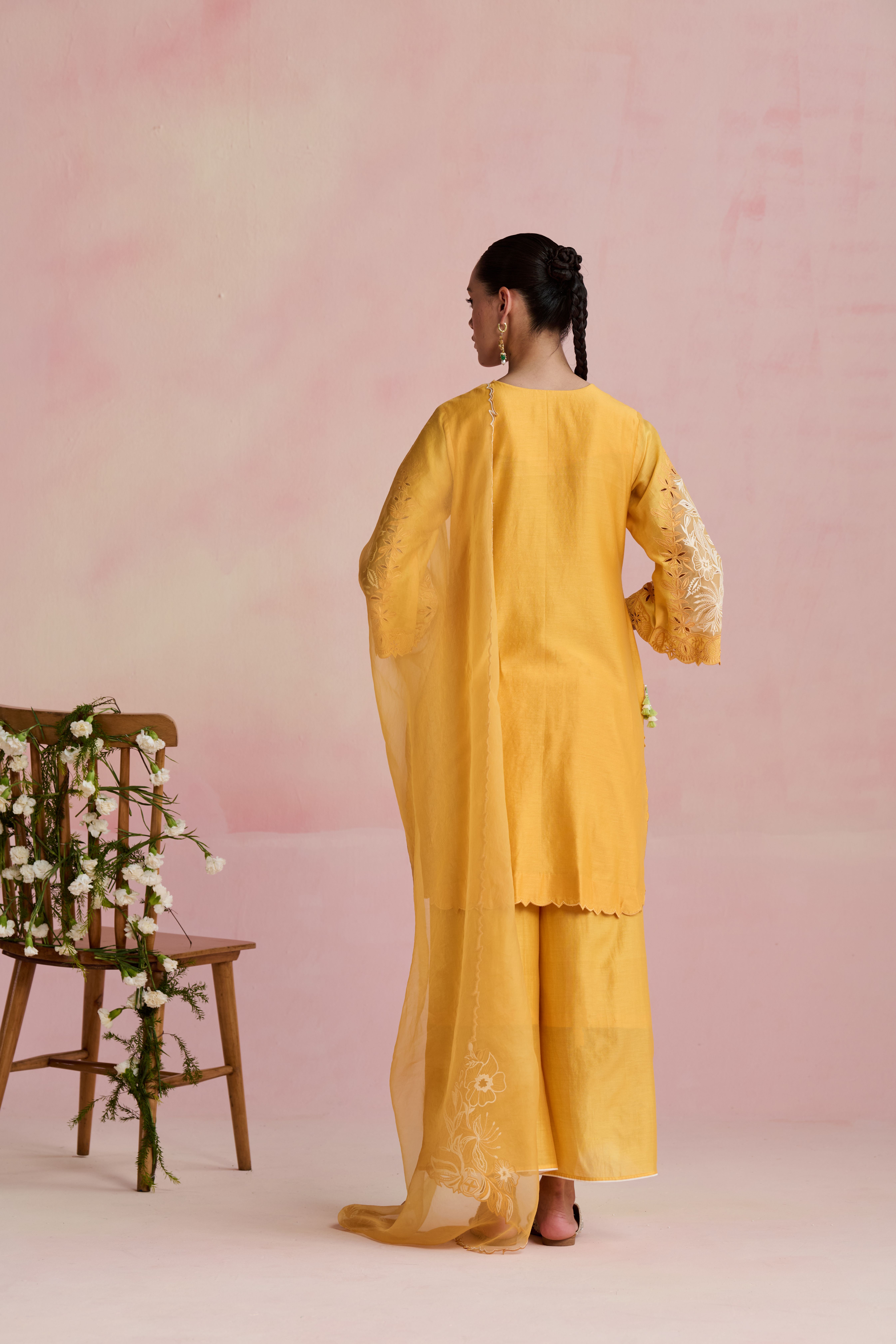 A model showcasing Ishana Yellow Kurta And Pants by Nirvair from Nirvair's collection