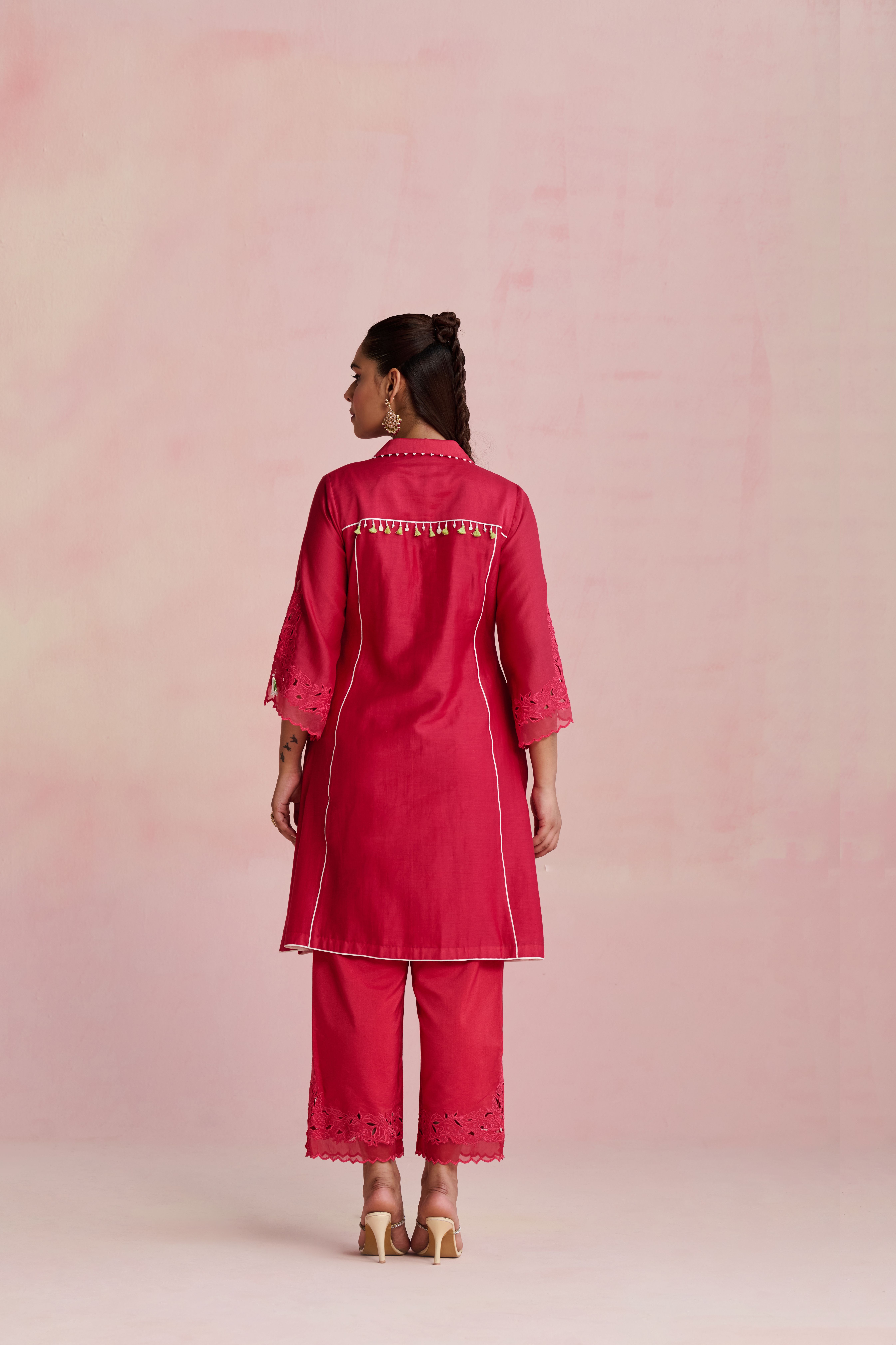 A model showcasing Vaani Raspberry Pink Kurta Set by Nirvair from Nirvair's collection