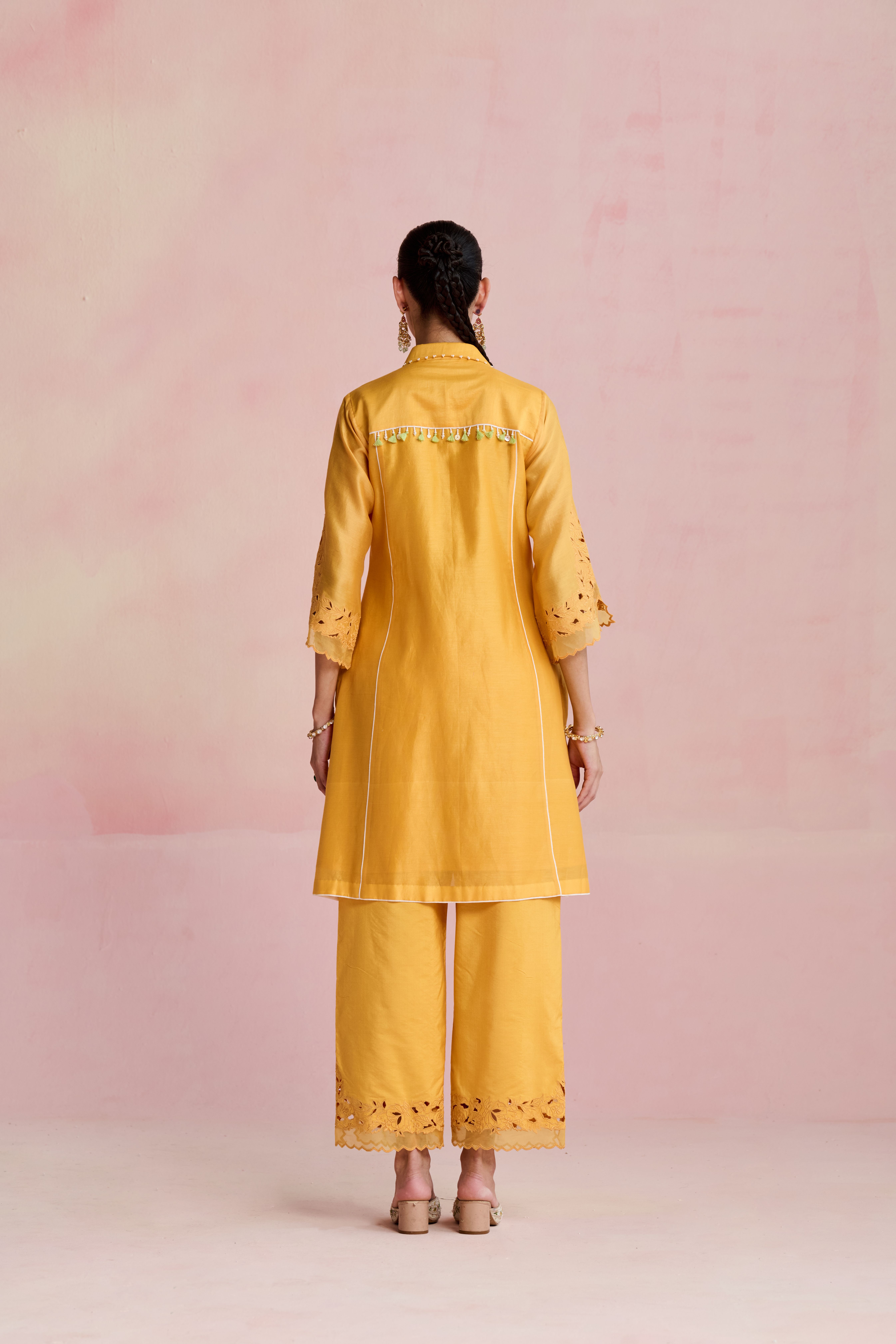A model showcasing Vaani Yellow Kurta And Trouser by Nirvair from Nirvair's collection