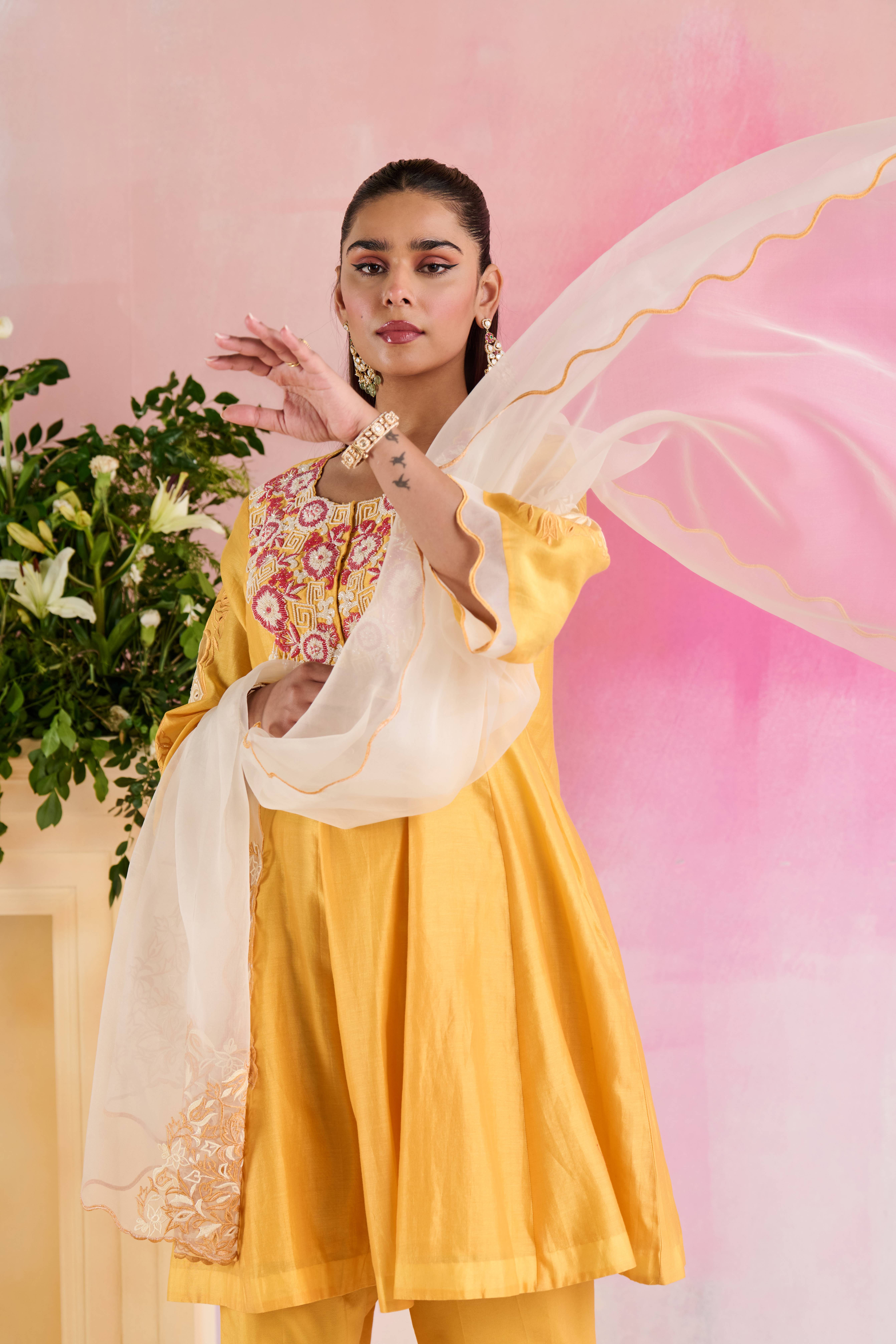A model showcasing Chhavi Yellow Kurta And Trouser by Nirvair from Nirvair's collection