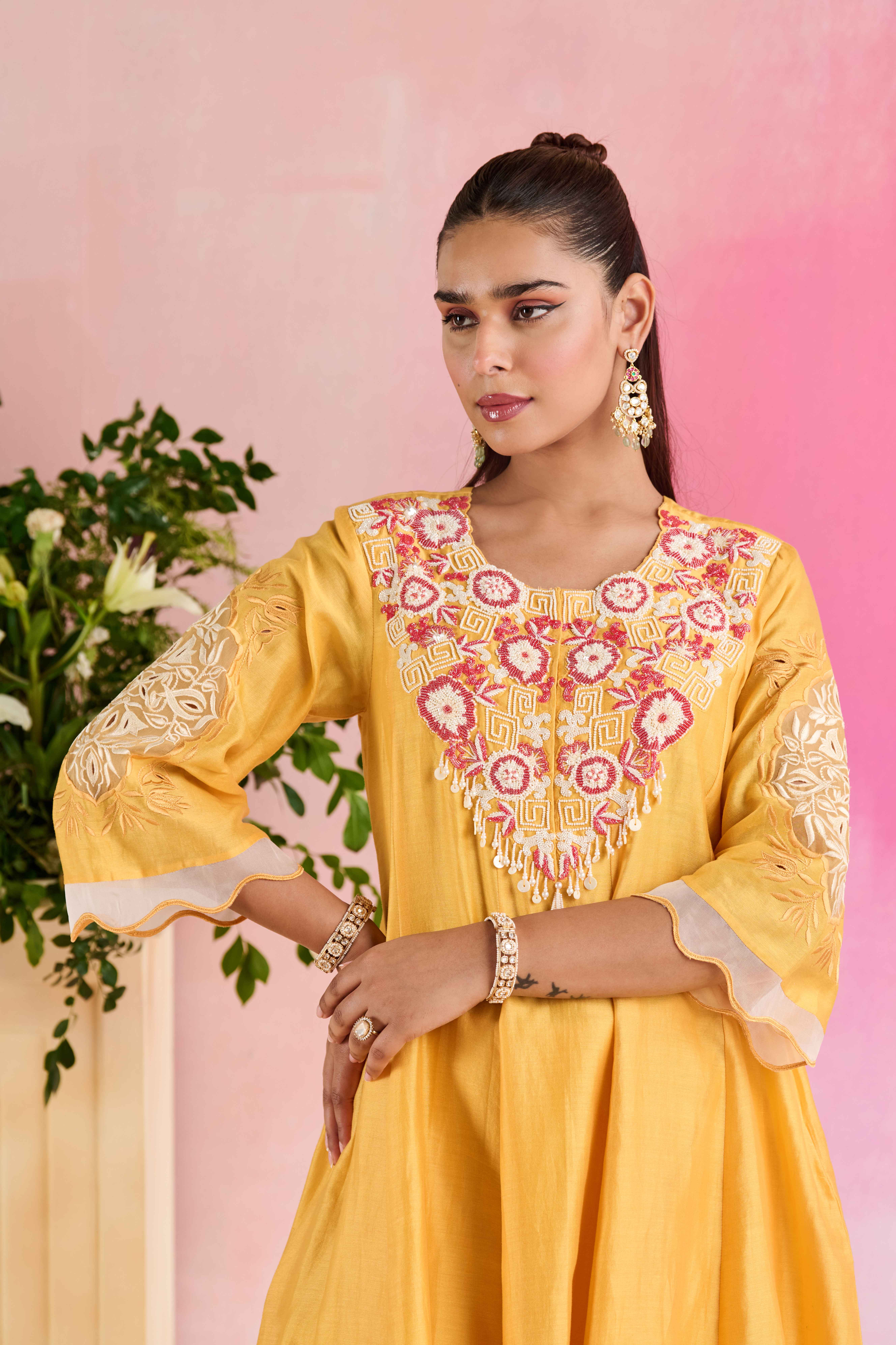 A model showcasing Chhavi Yellow Kurta And Trouser by Nirvair from Nirvair's collection