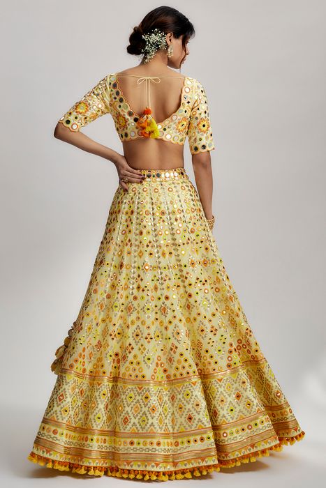 A model showcasing Yellow Anha Lehenga Set by Gopi Vaid from Gopi Vaid's collection