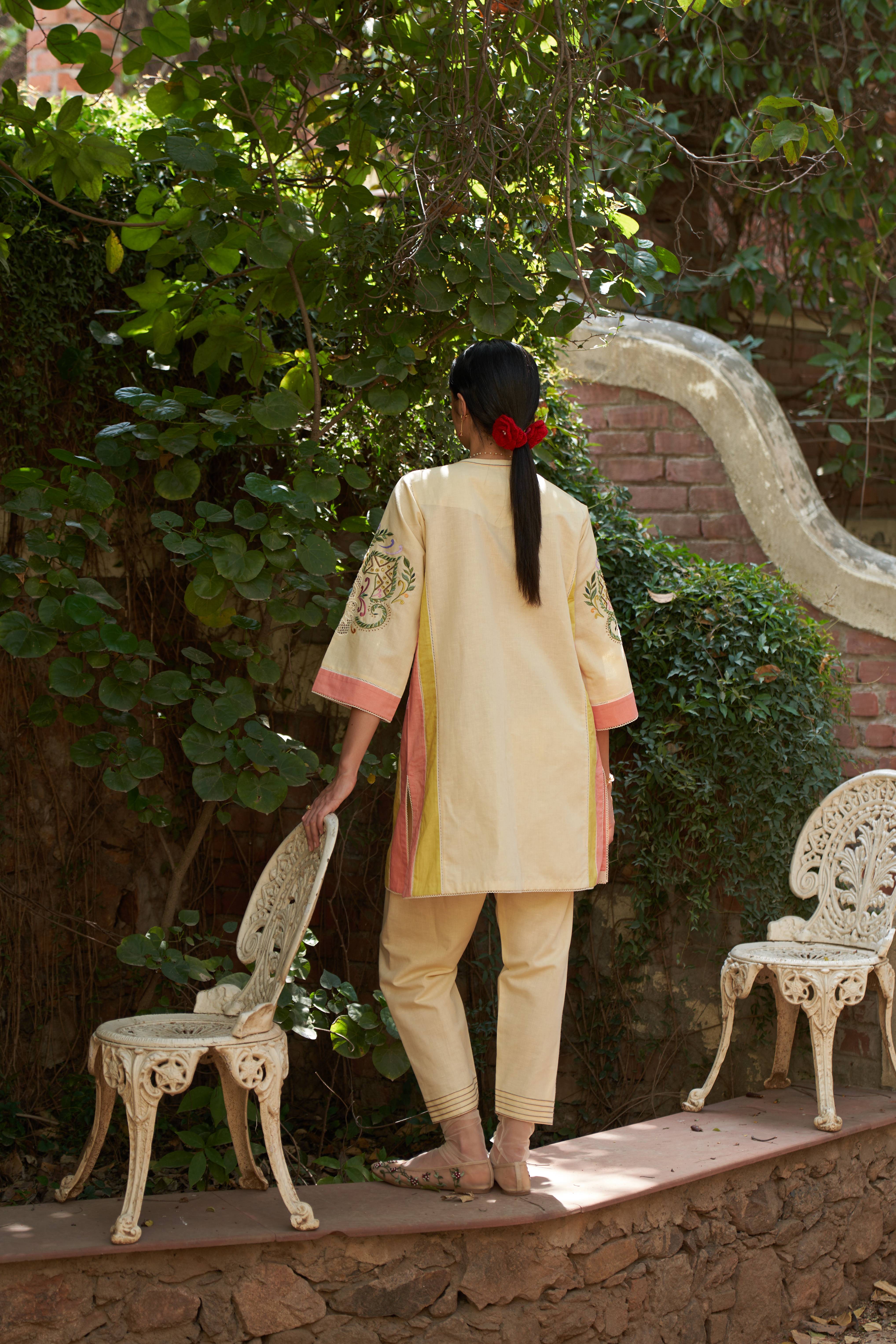 A model showcasing Zinnia Kurta With Salwar Set by Nirvair from Nirvair's collection