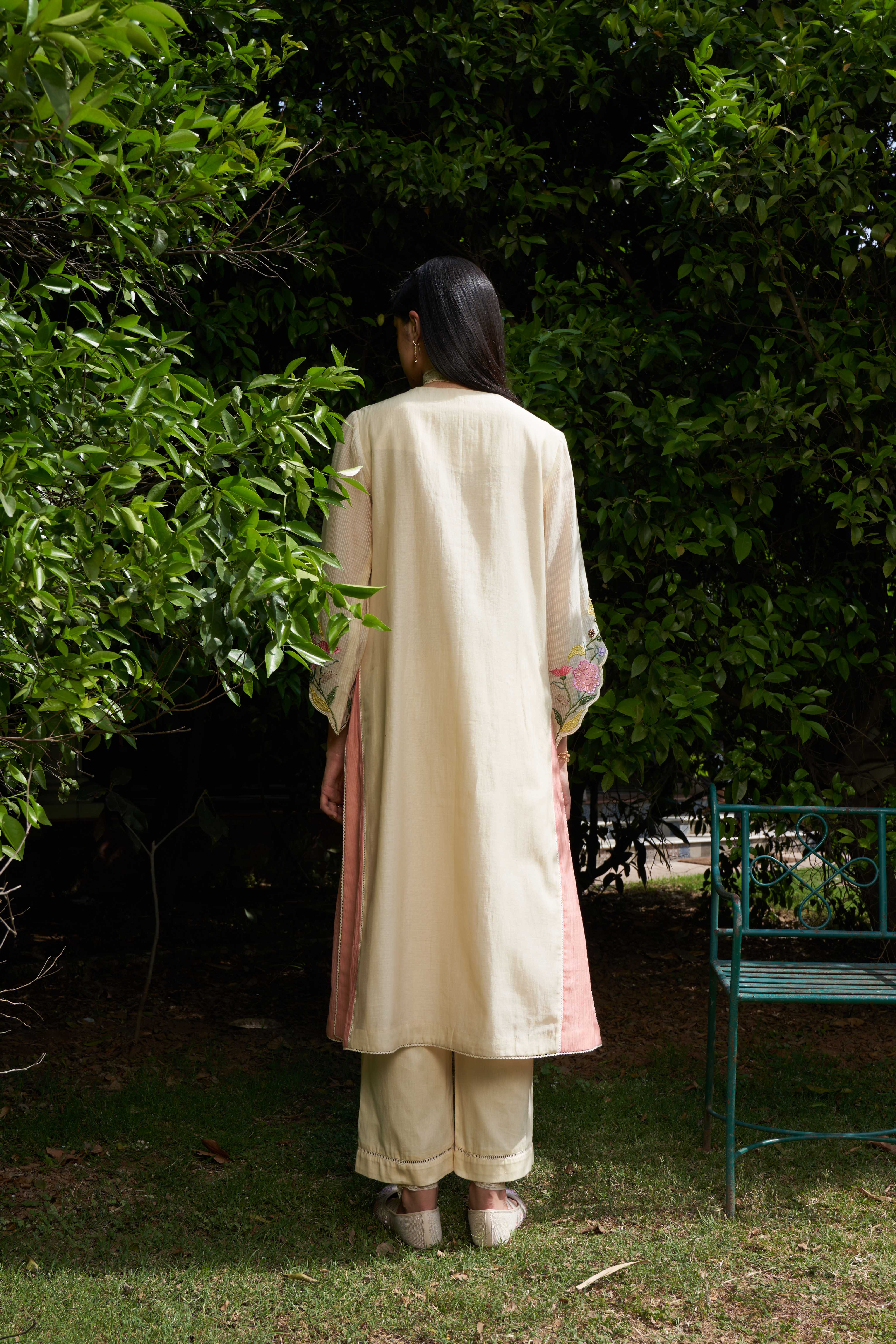 A model showcasing Iris Cream Kurta Set by Nirvair from Nirvair's collection