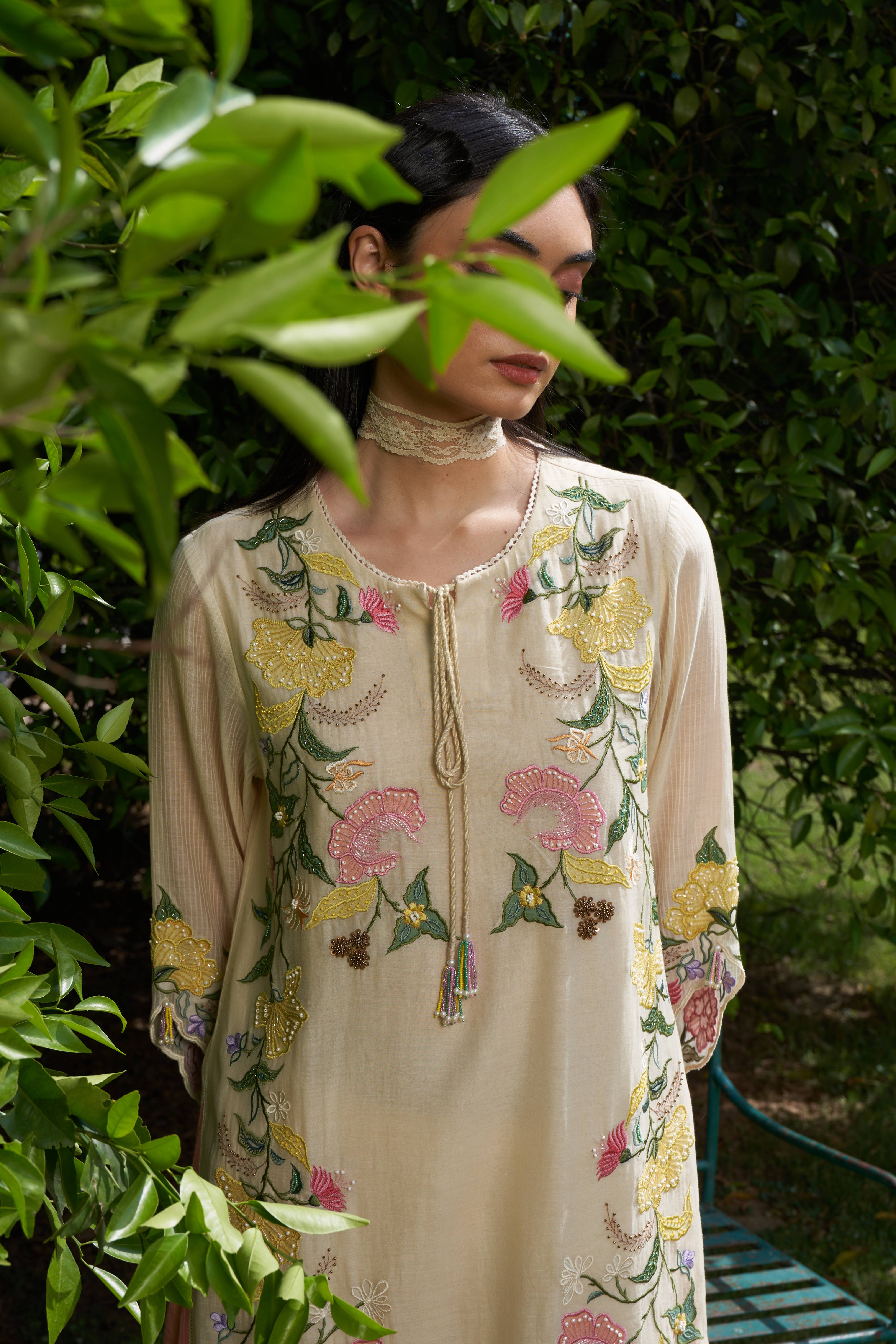 A model showcasing Iris Cream Kurta Set by Nirvair from Nirvair's collection