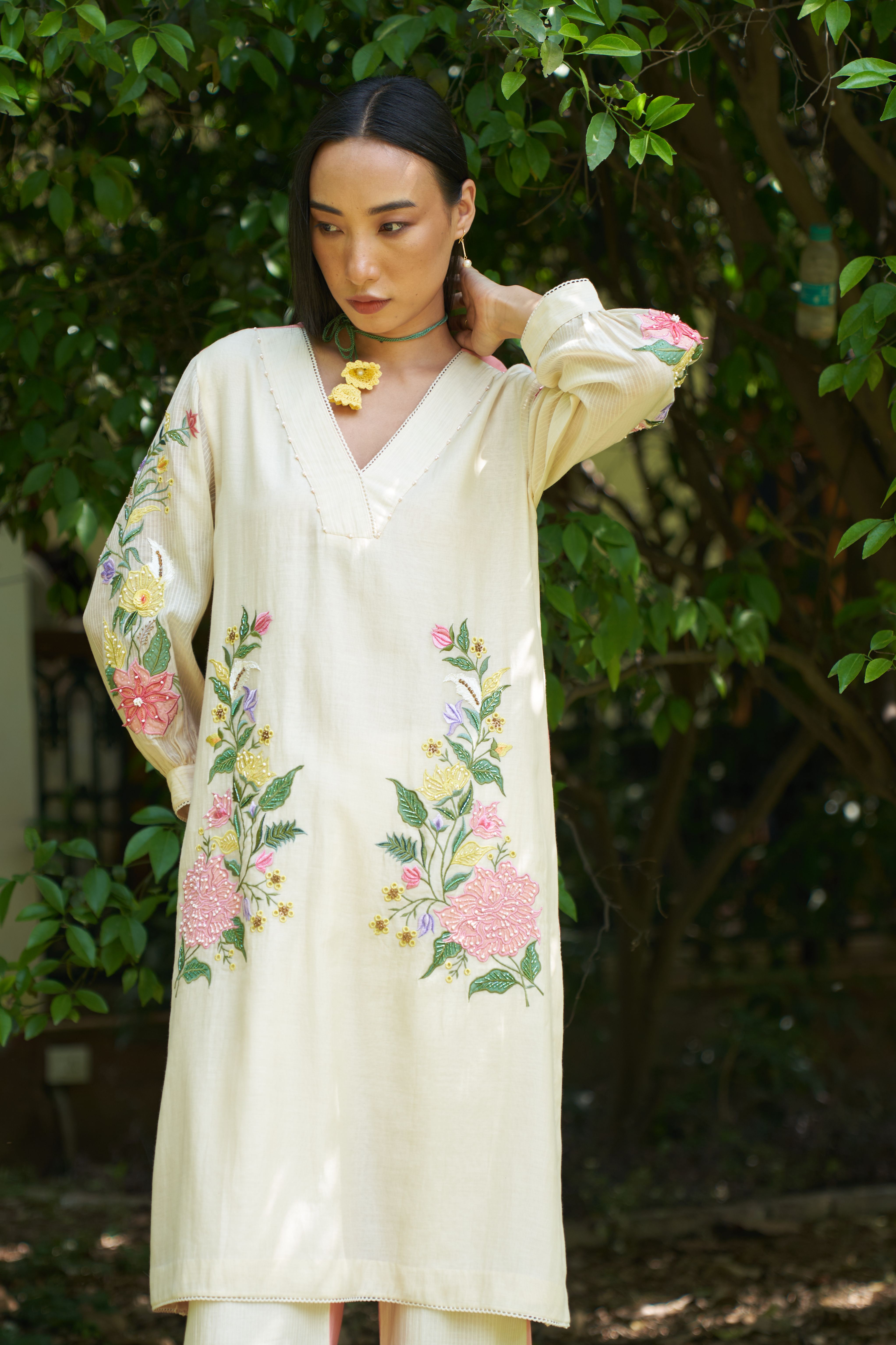 A model showcasing Blossom Kurta With Pants by Nirvair from Nirvair's collection
