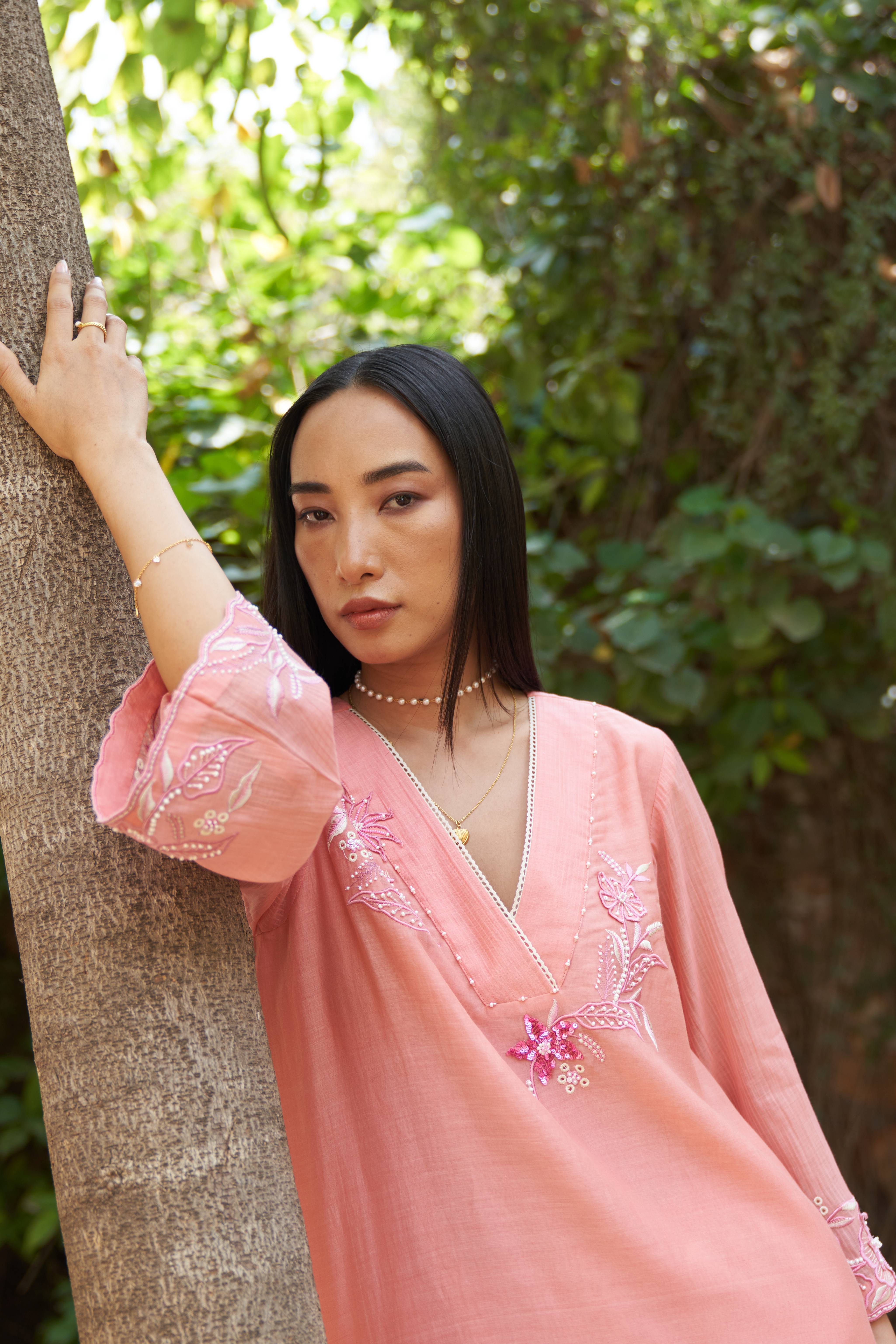A model showcasing Azalea Peach Bloom Kurta Set by Nirvair from Nirvair's collection