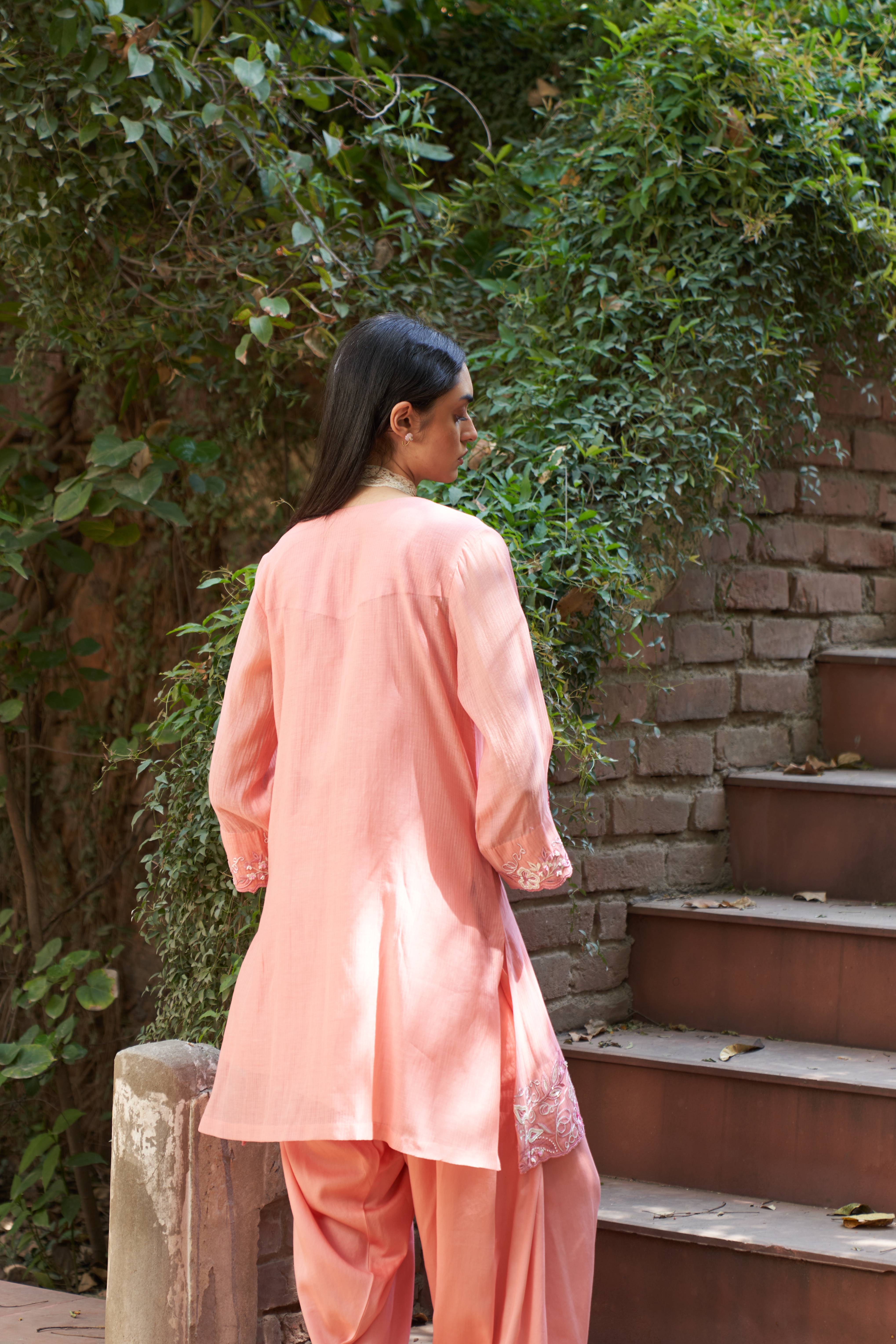 A model showcasing Carnation Kurta Set With Farshi Salwar by Nirvair from Nirvair's collection