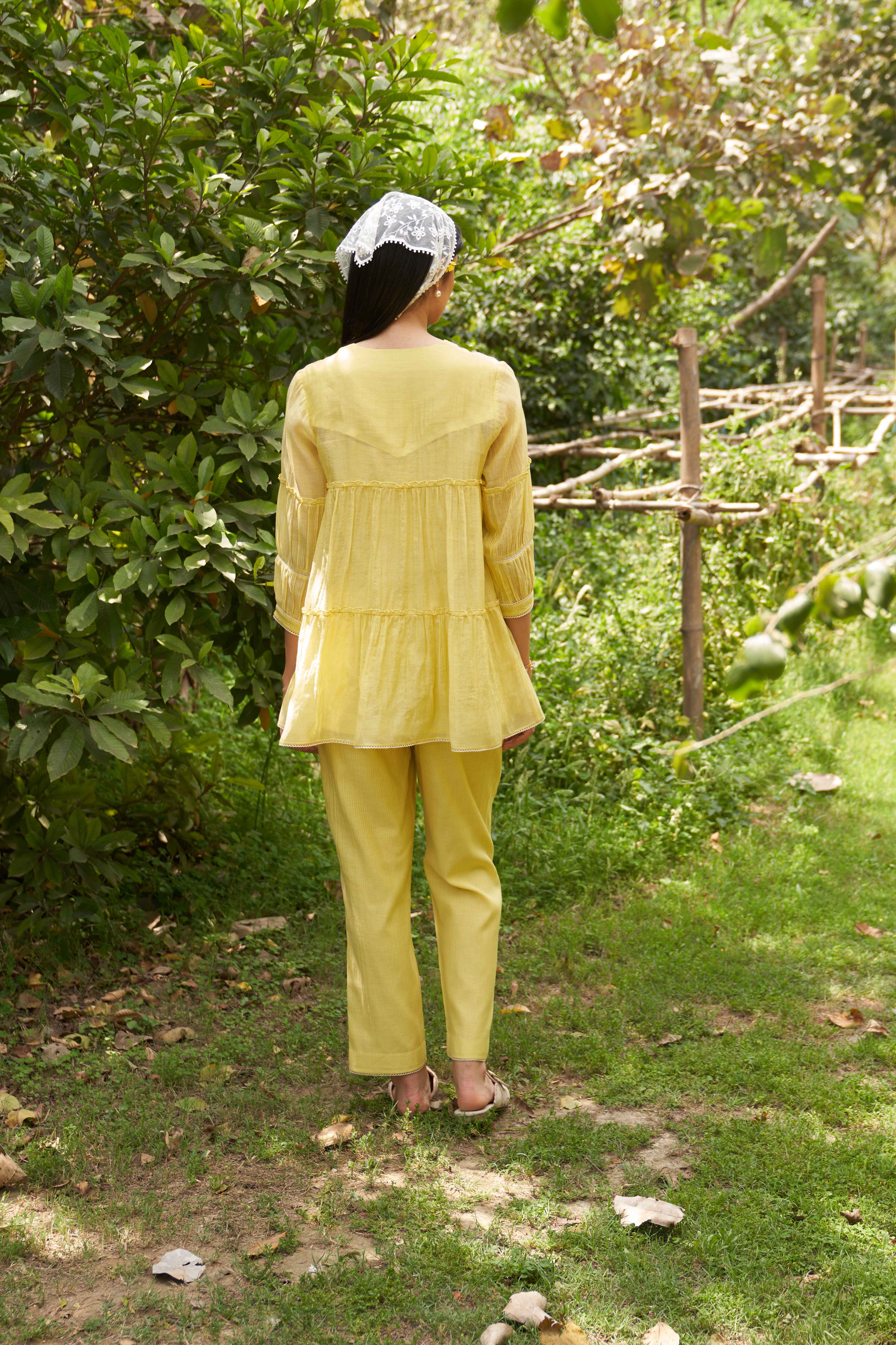 A model showcasing Magnolia Lemon Zest Coord Set by Nirvair from Nirvair's collection