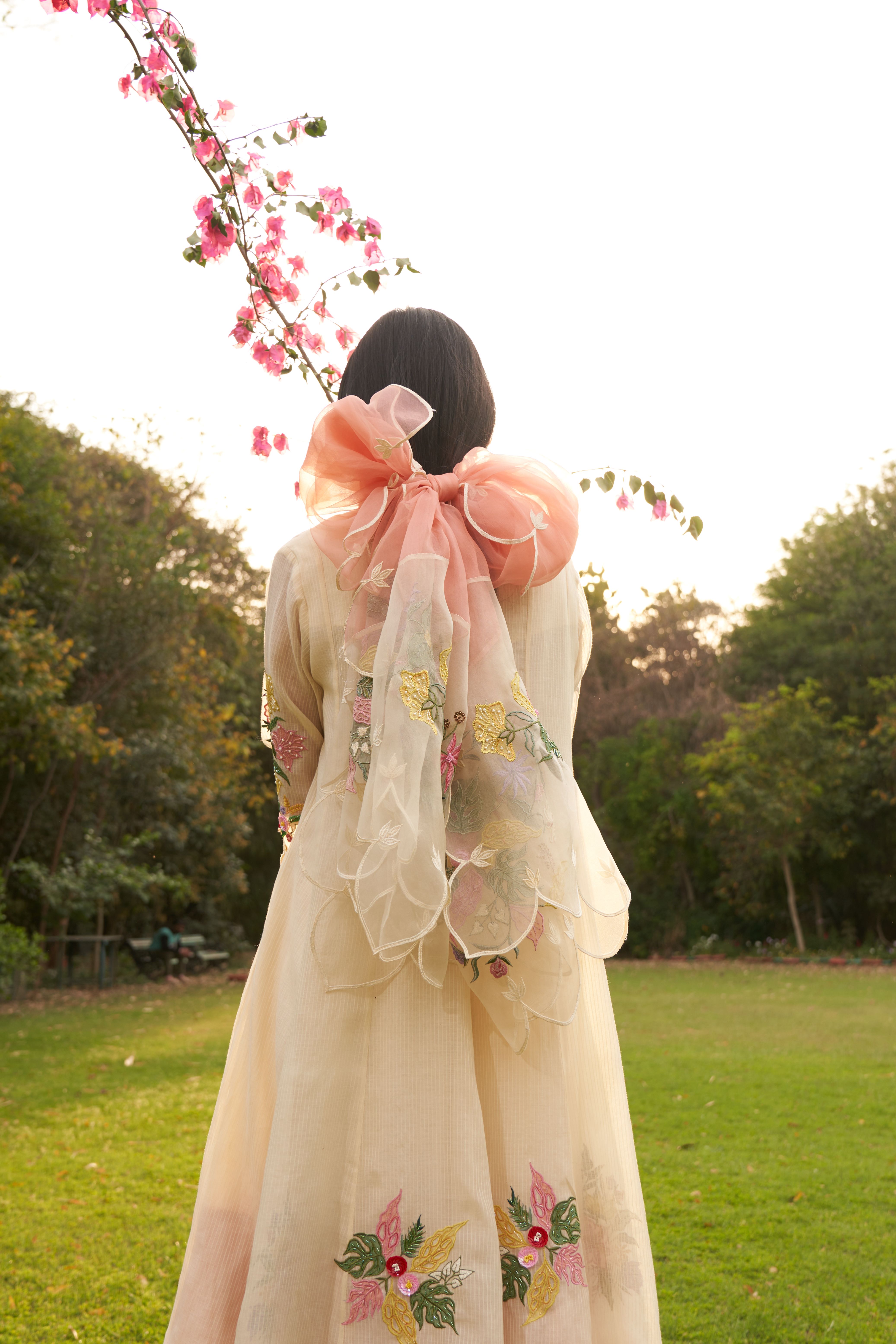 A model showcasing Sweet Peach Beige Embroidery Organza Dupatta by Nirvair from Nirvair's collection