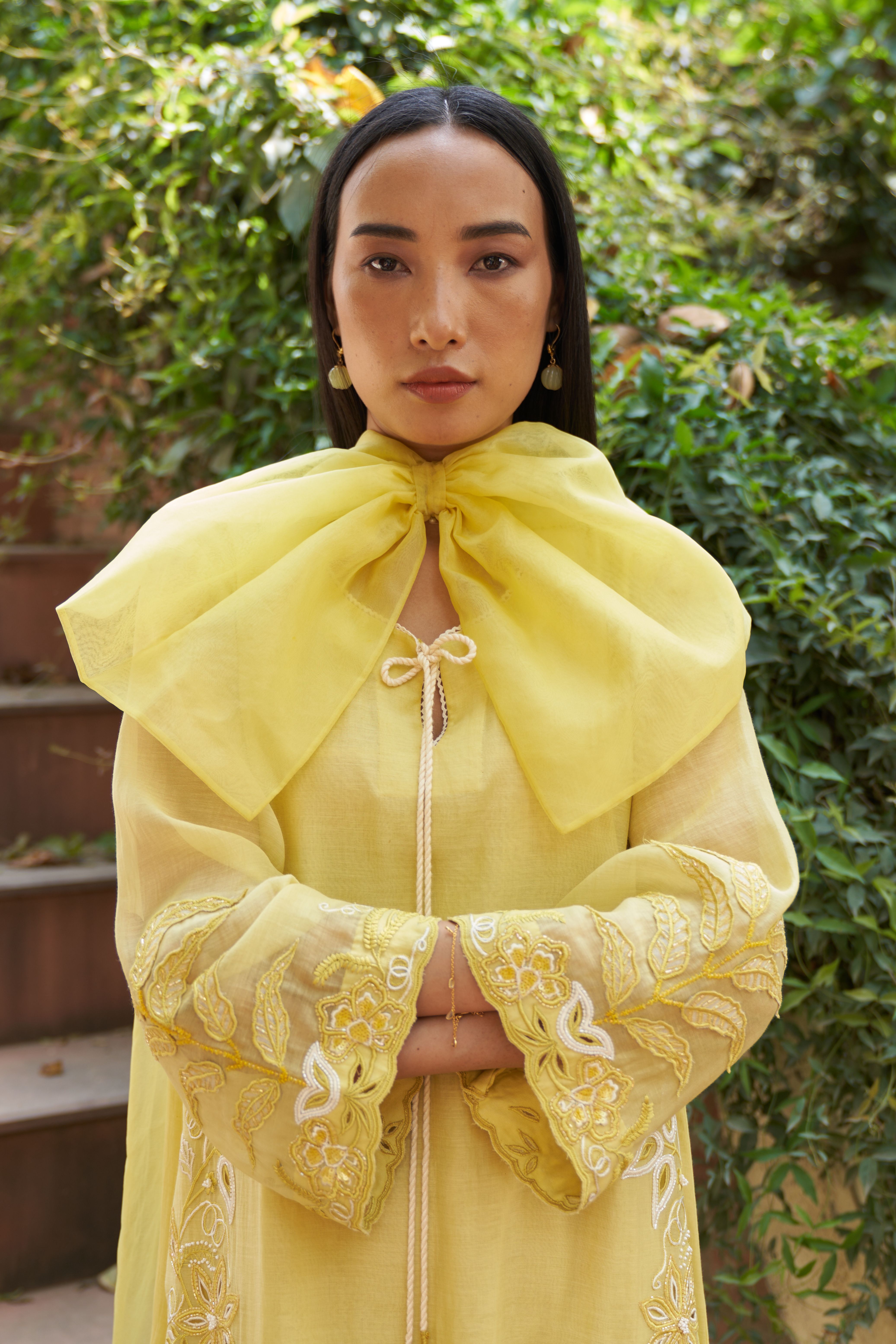 A model showcasing Poppy Lime Organza Dupatta by Nirvair from Nirvair's collection A model showcasing Poppy Lime Organza Dupatta by Nirvair from Nirvair's collection