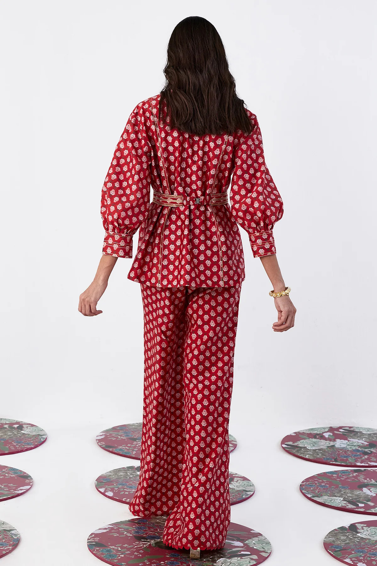 A model showcasing Fioralba Red Printed Coord Set by Ridhi Mehra from Ridhi Mehra's collection A model showcasing Fioralba Red Printed Coord Set by Ridhi Mehra from Ridhi Mehra's collection