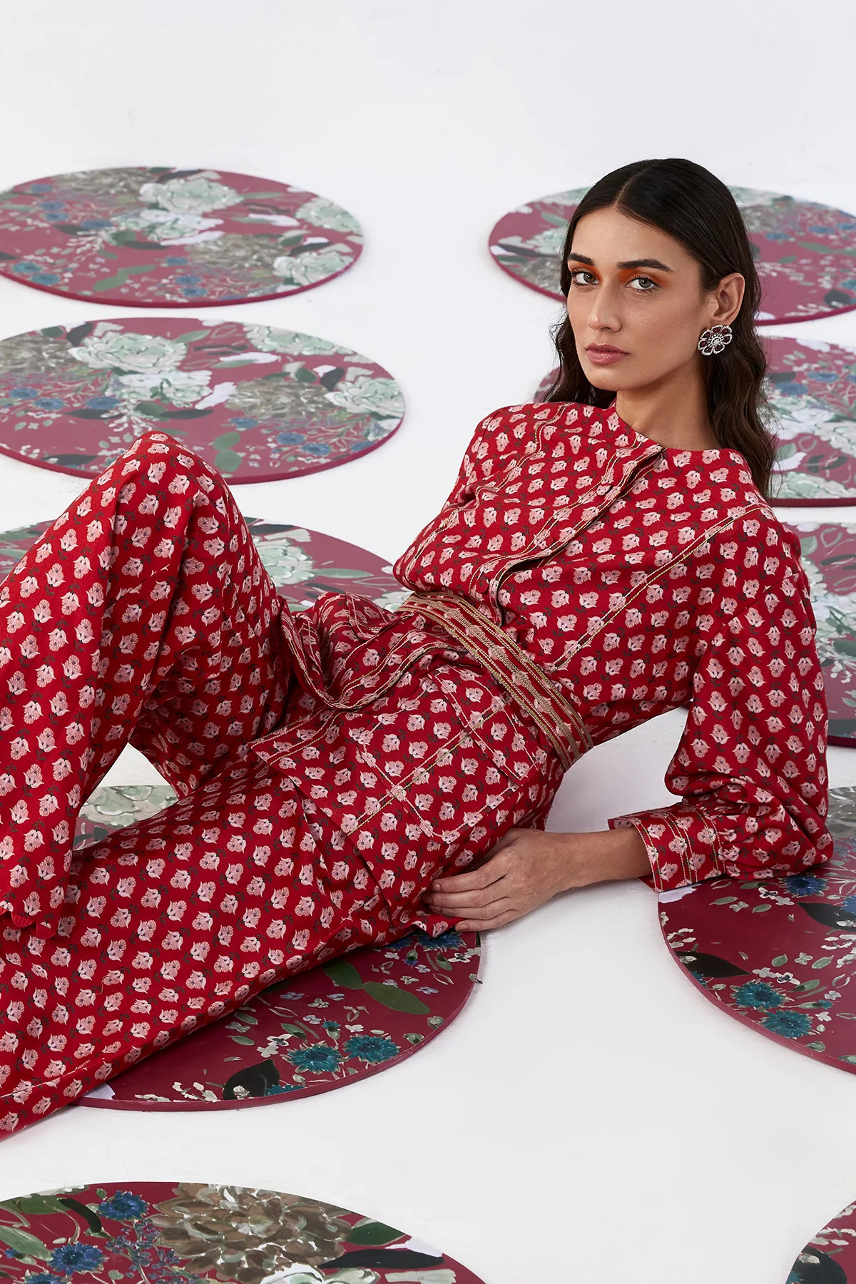 A model showcasing Fioralba Red Printed Coord Set by Ridhi Mehra from Ridhi Mehra's collection A model showcasing Fioralba Red Printed Coord Set by Ridhi Mehra from Ridhi Mehra's collection
