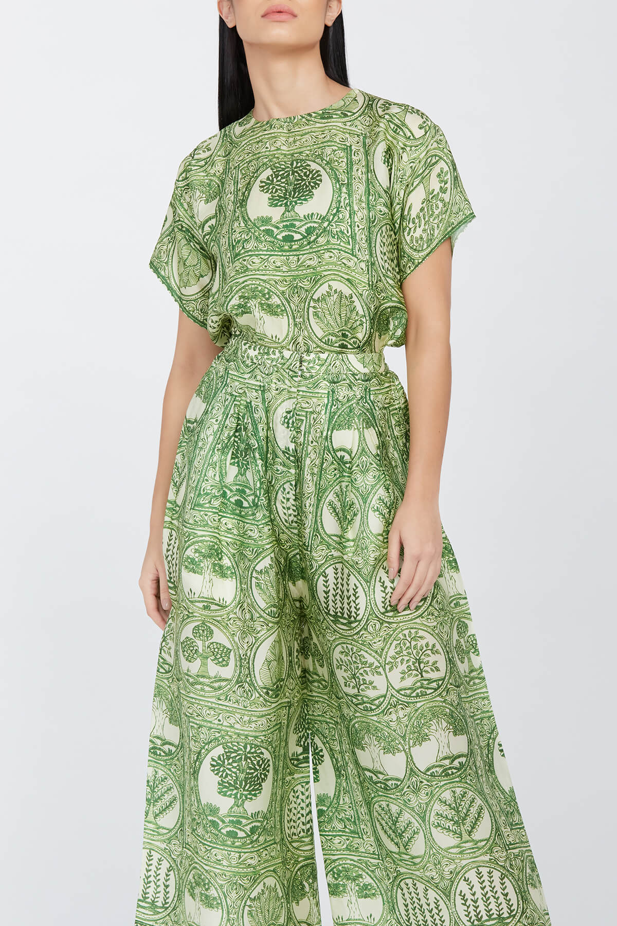 A model showcasing Green Printed Silk Coord Set by Aarti Vijay Gupta from Aarti Vijay Gupta's collection A model showcasing Green Printed Silk Coord Set by Aarti Vijay Gupta from Aarti Vijay Gupta's collection