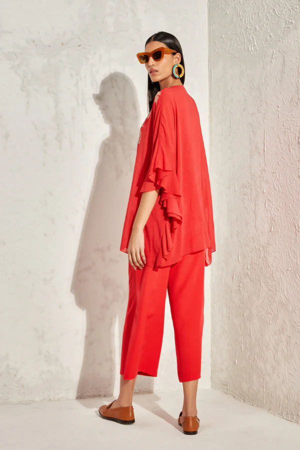 A model showcasing Forsythia Frill Sleeve Kaftan Top by Namrata Joshlpura from Namrata Joshlpura's collection A model showcasing Forsythia Frill Sleeve Kaftan Top by Namrata Joshlpura from Namrata Joshlpura's collection