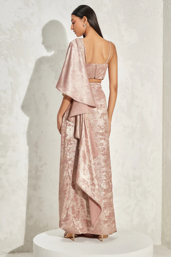 A model showcasing Belladonna Cape Shimmer Set by Namrata Joshlpura from Namrata Joshlpura's collection A model showcasing Belladonna Cape Shimmer Set by Namrata Joshlpura from Namrata Joshlpura's collection