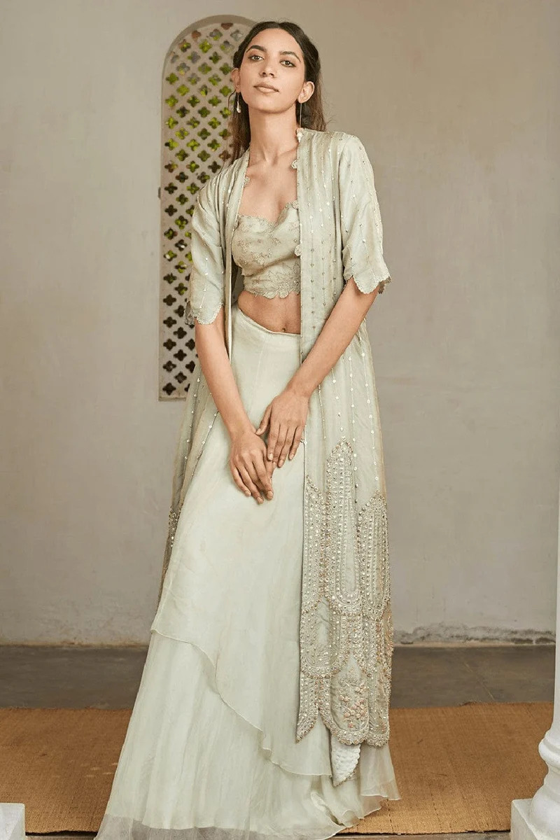 A model showcasing Ivory Optical Embroidered Jacket Lehenga Set Feature image by Ossa from Ossa's collection