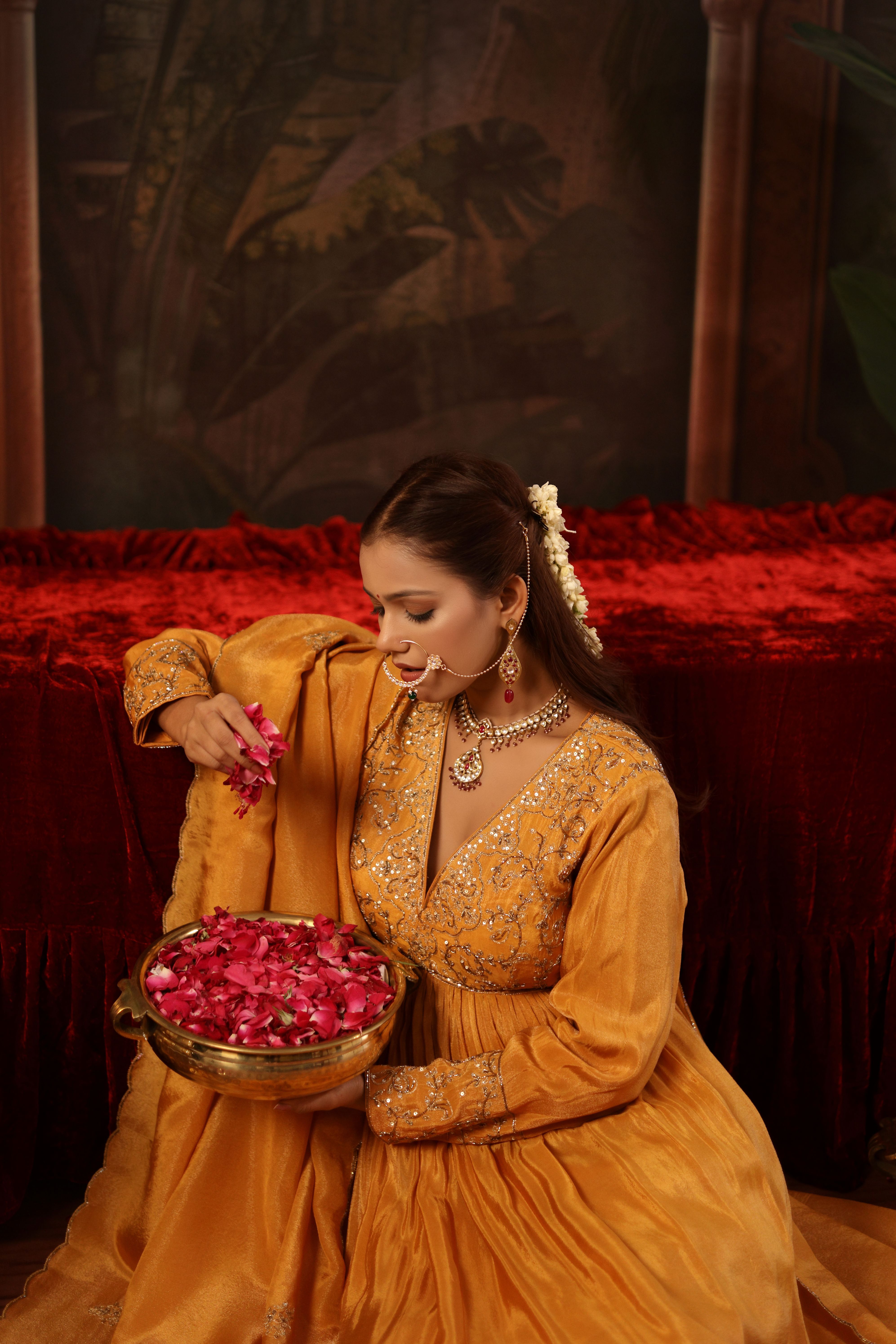 A model showcasing Aranya Mustard Anarkali Set by Miku Kumar from Miku Kumar's collection