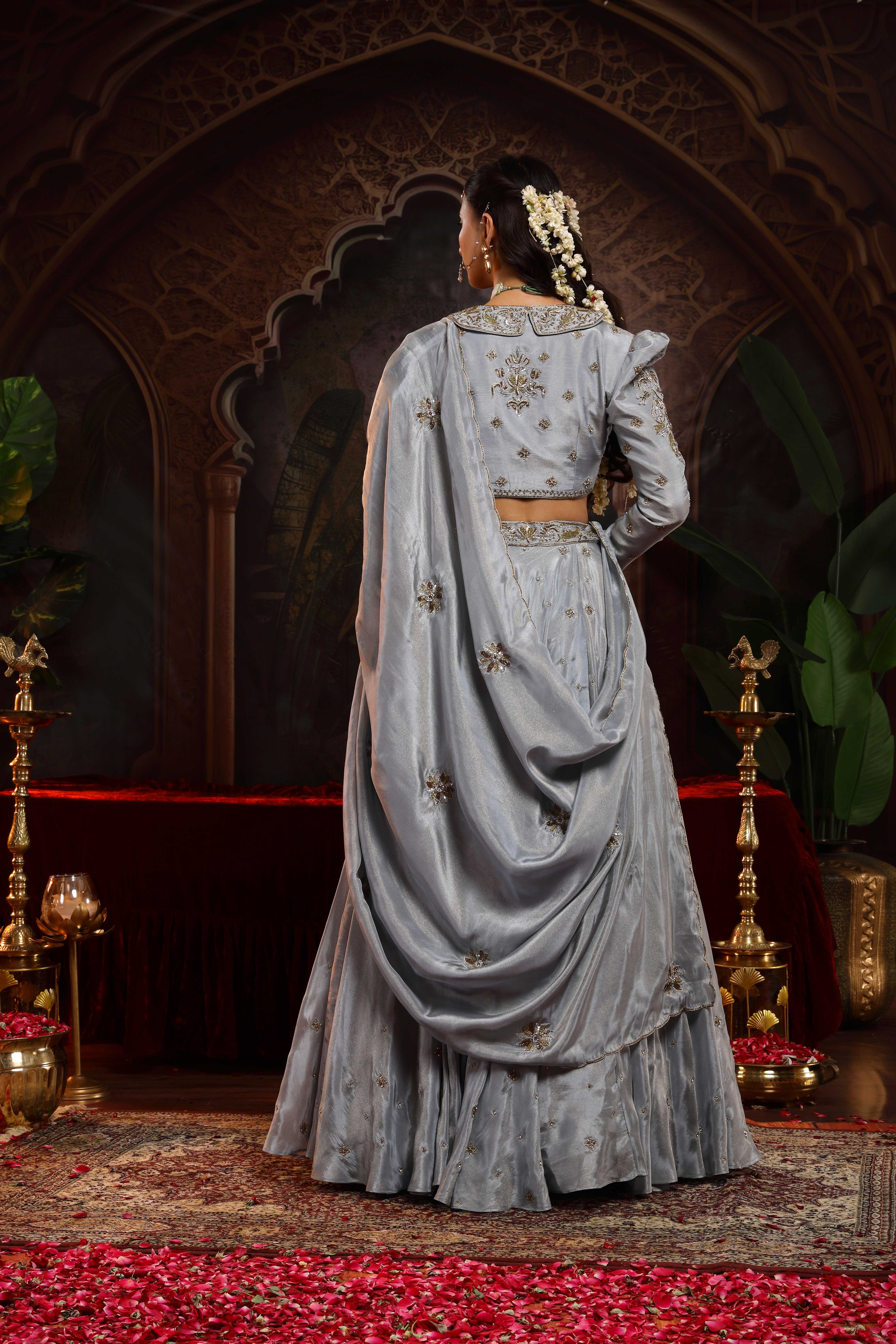 A model showcasing Saanjh Grey Jacket Lehenga Set by Miku Kumar from Miku Kumar's collection