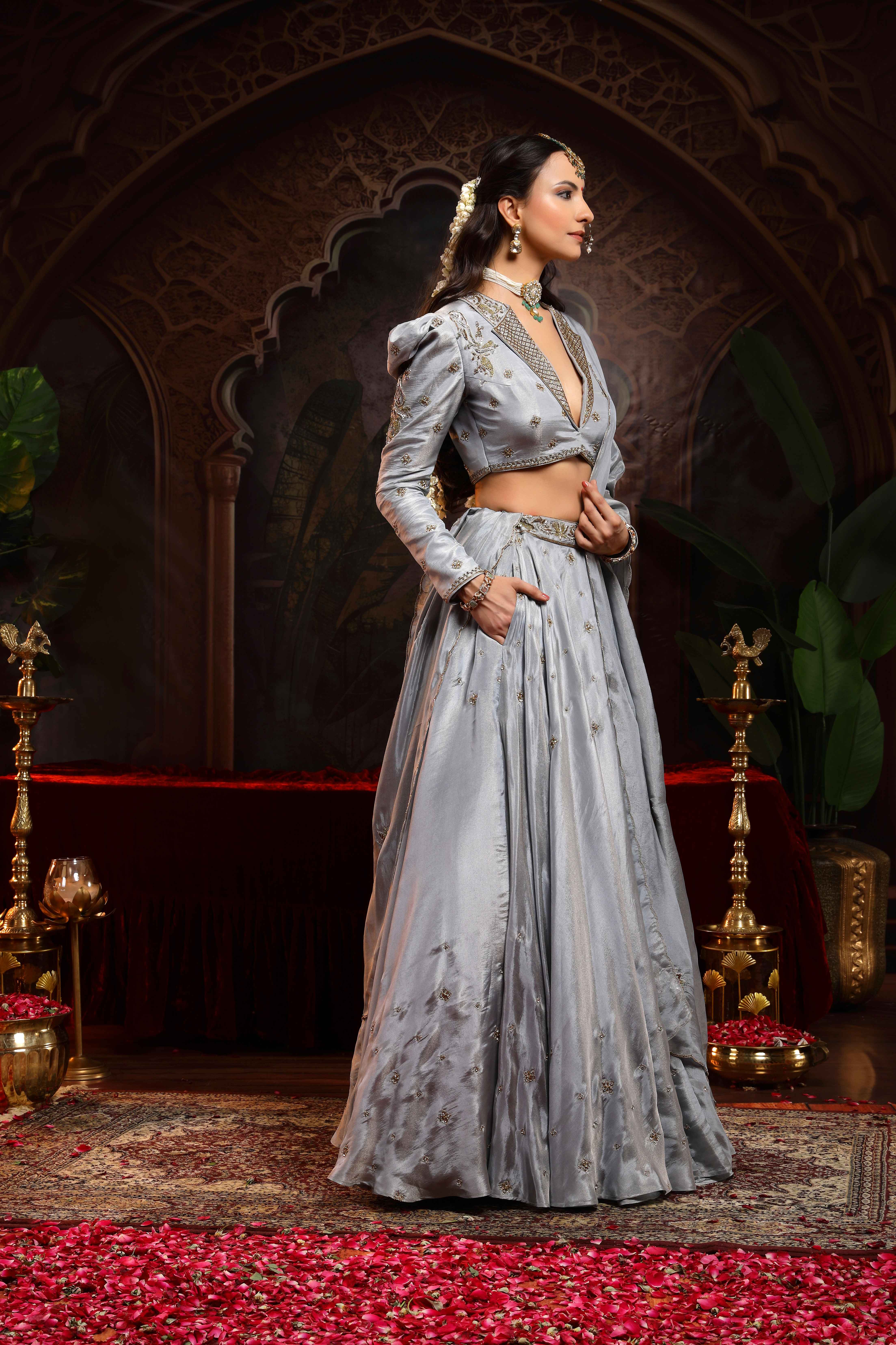 A model showcasing Saanjh Grey Jacket Lehenga Set by Miku Kumar from Miku Kumar's collection