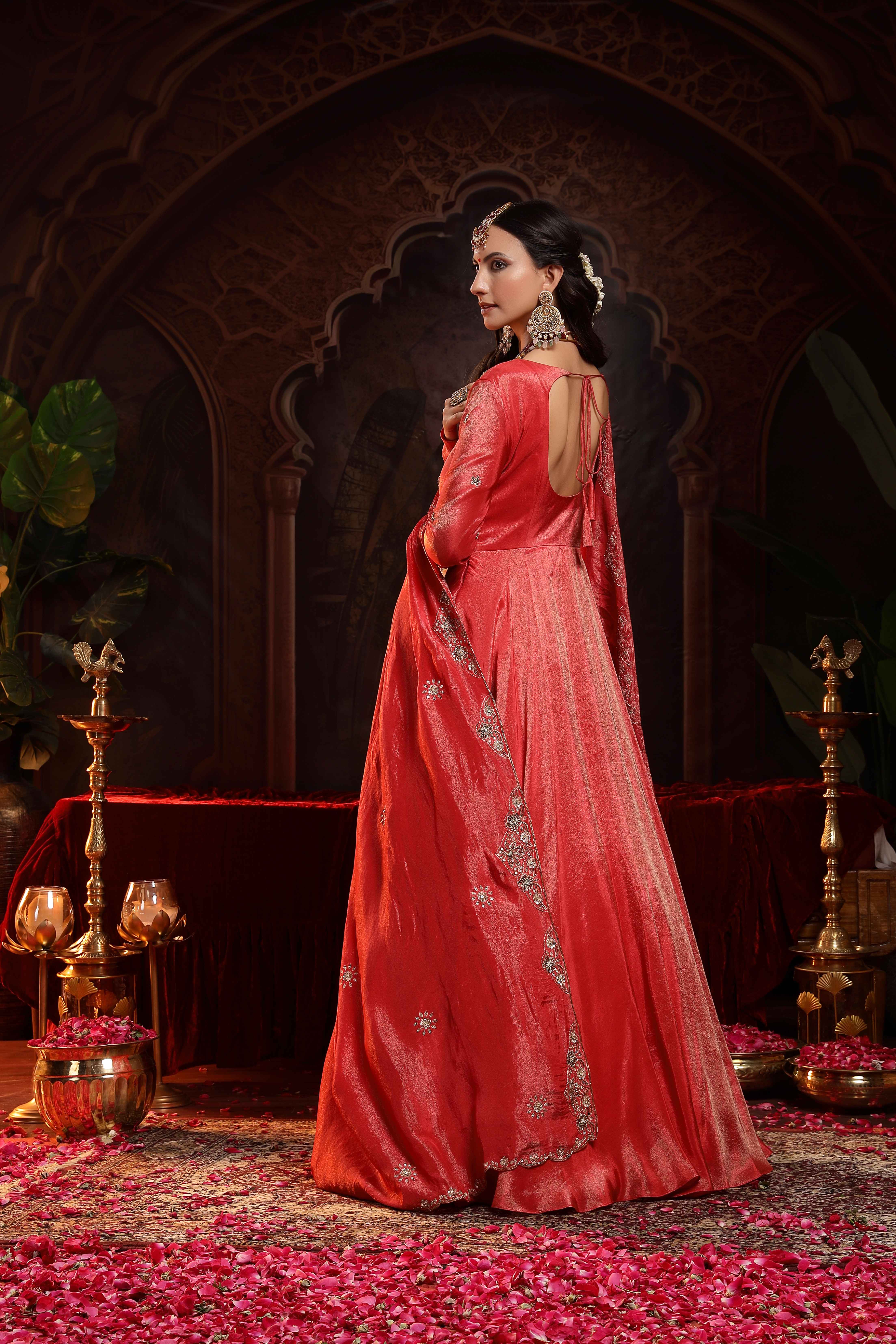 A model showcasing Shanaya Red Anarkali Set by Miku Kumar from Miku Kumar's collection