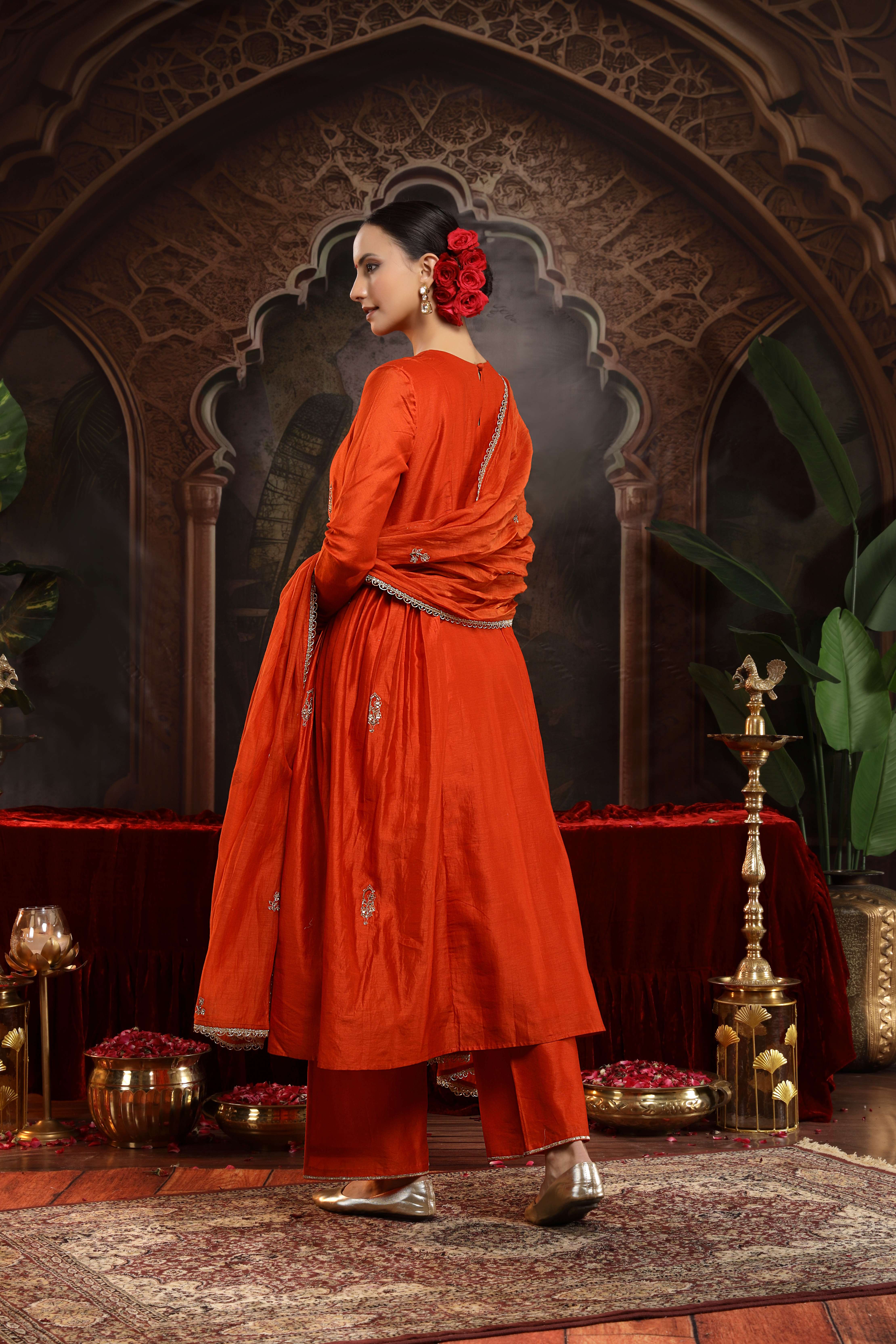 A model showcasing Kanika Chanderi Silk Suit by Miku Kumar from Miku Kumar's collection