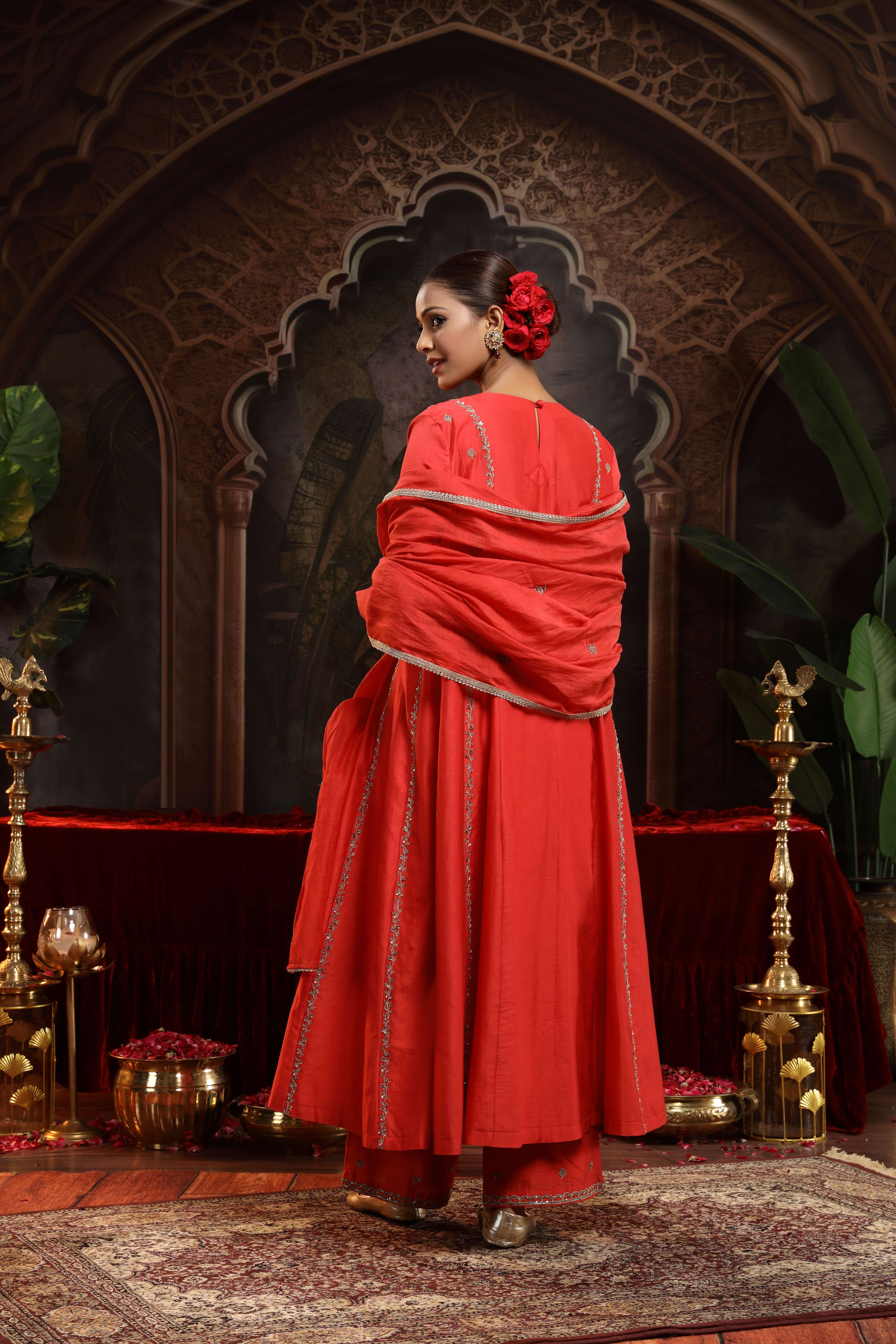 A model showcasing Anvi Red Chanderi Silk Suit by Miku Kumar from Miku Kumar's collection