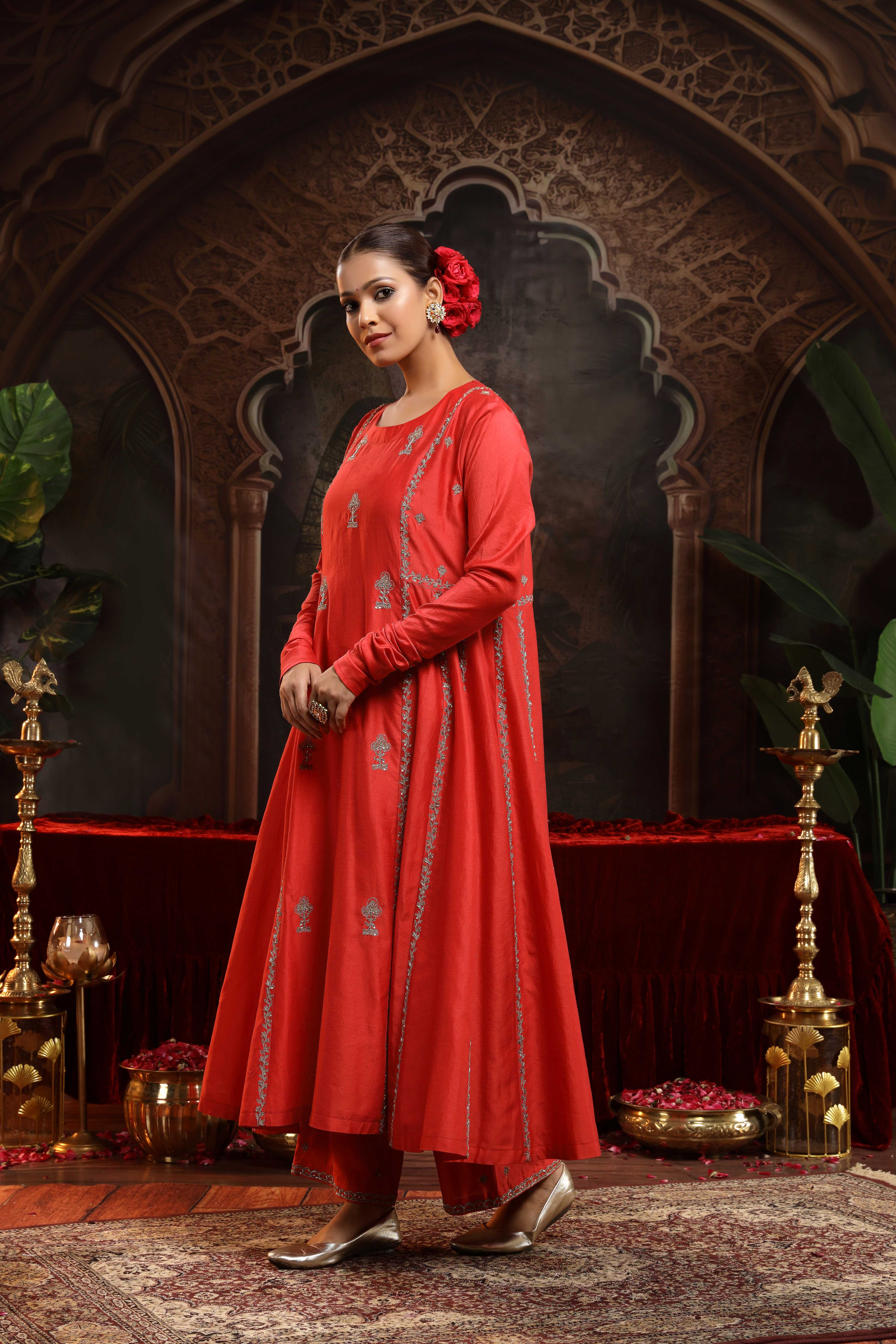 A model showcasing Anvi Red Chanderi Silk Suit by Miku Kumar from Miku Kumar's collection
