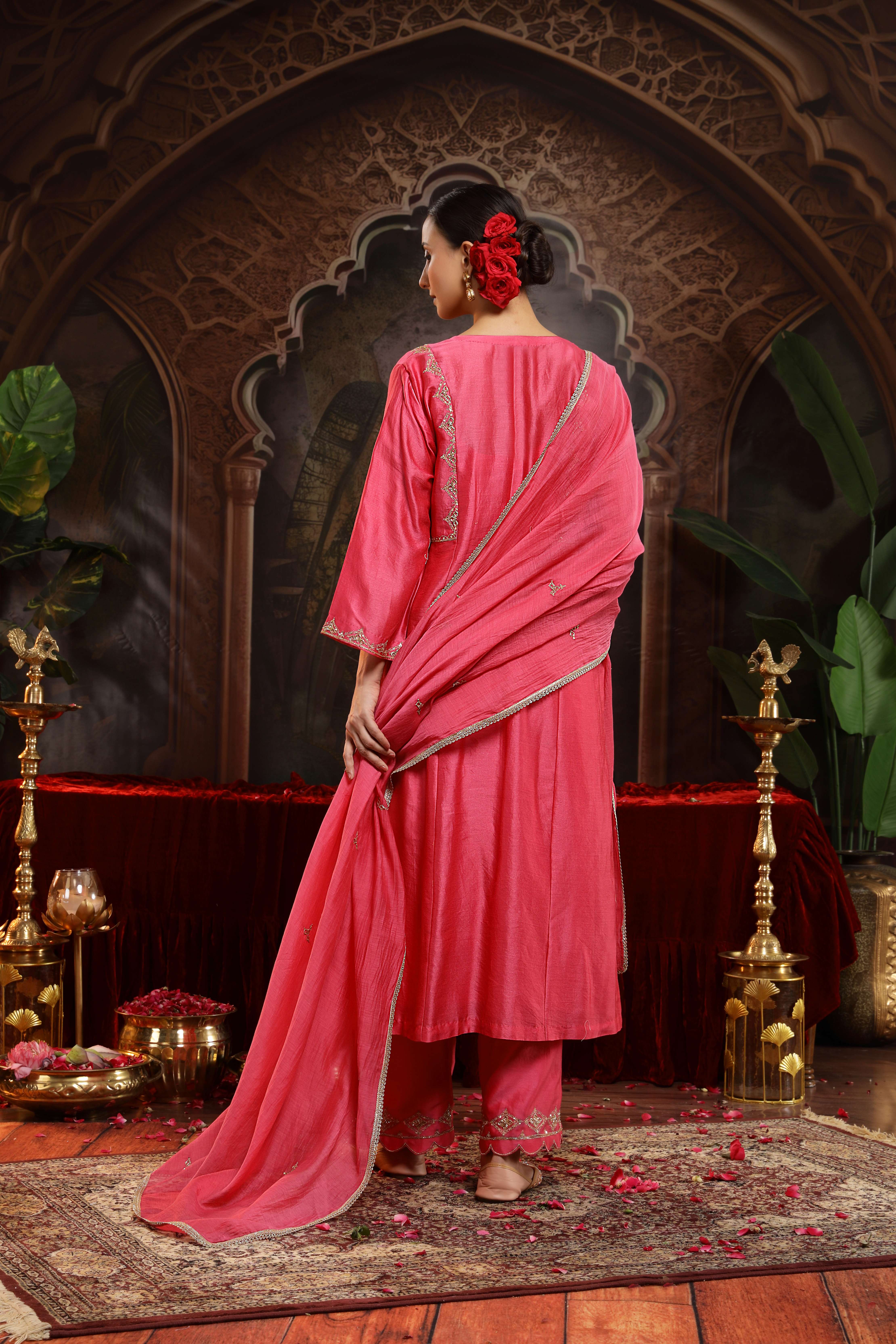 A model showcasing Suhina Hot Pink Suit by Miku Kumar from Miku Kumar's collection