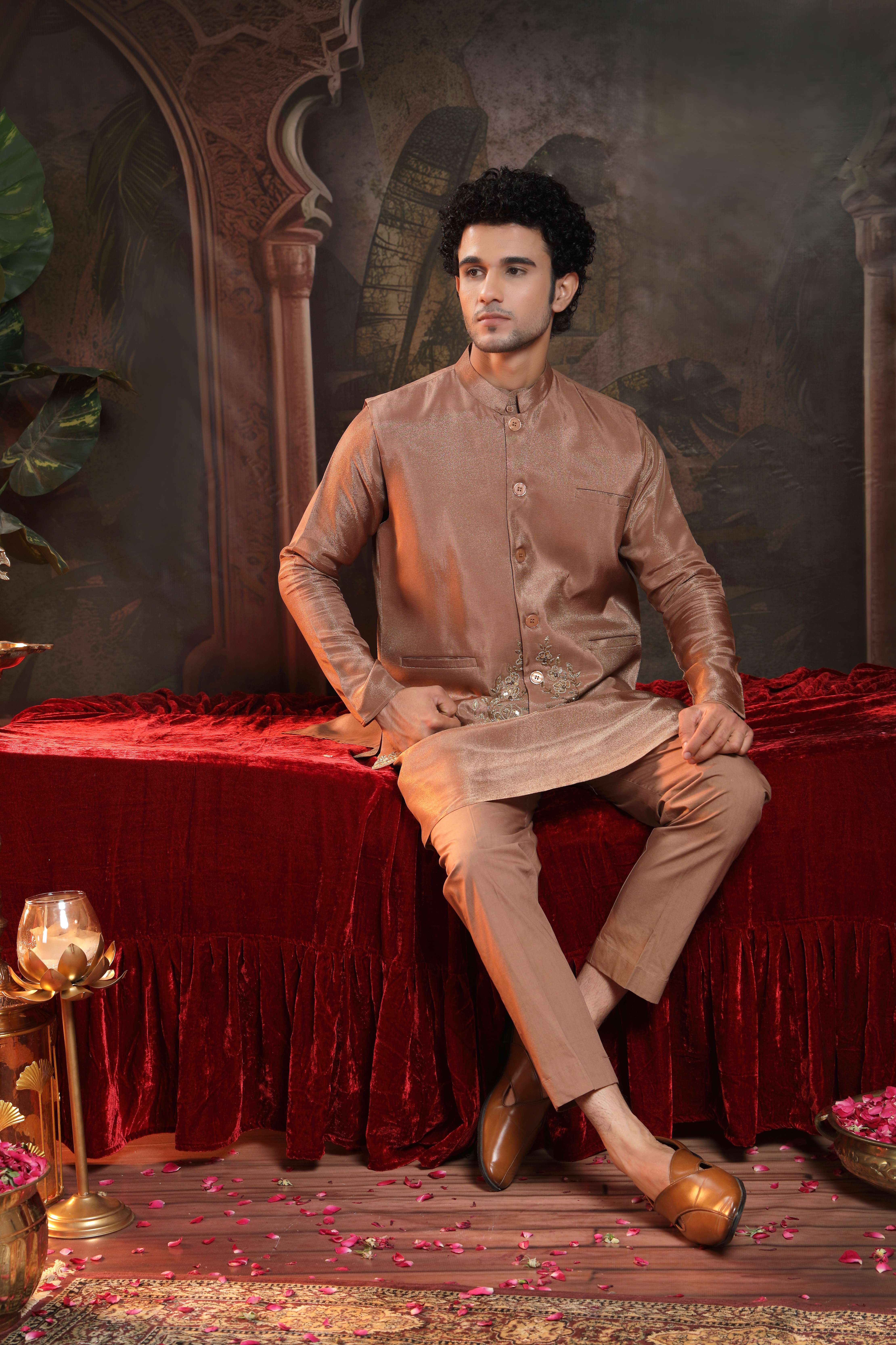 A model showcasing Tanv Copper Sherwani Set by Miku Kumar from Miku Kumar's collection