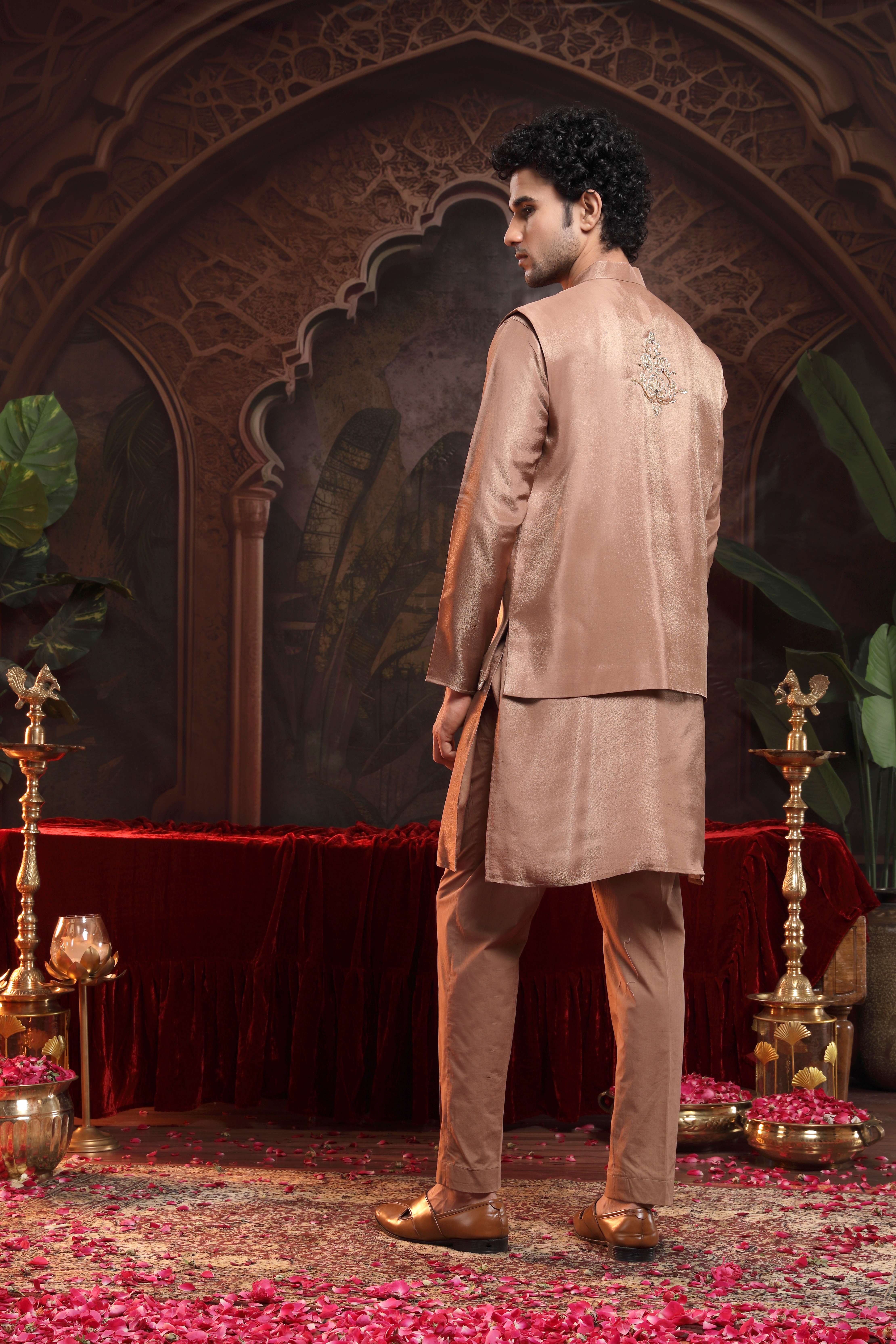 A model showcasing Tanv Copper Sherwani Set by Miku Kumar from Miku Kumar's collection