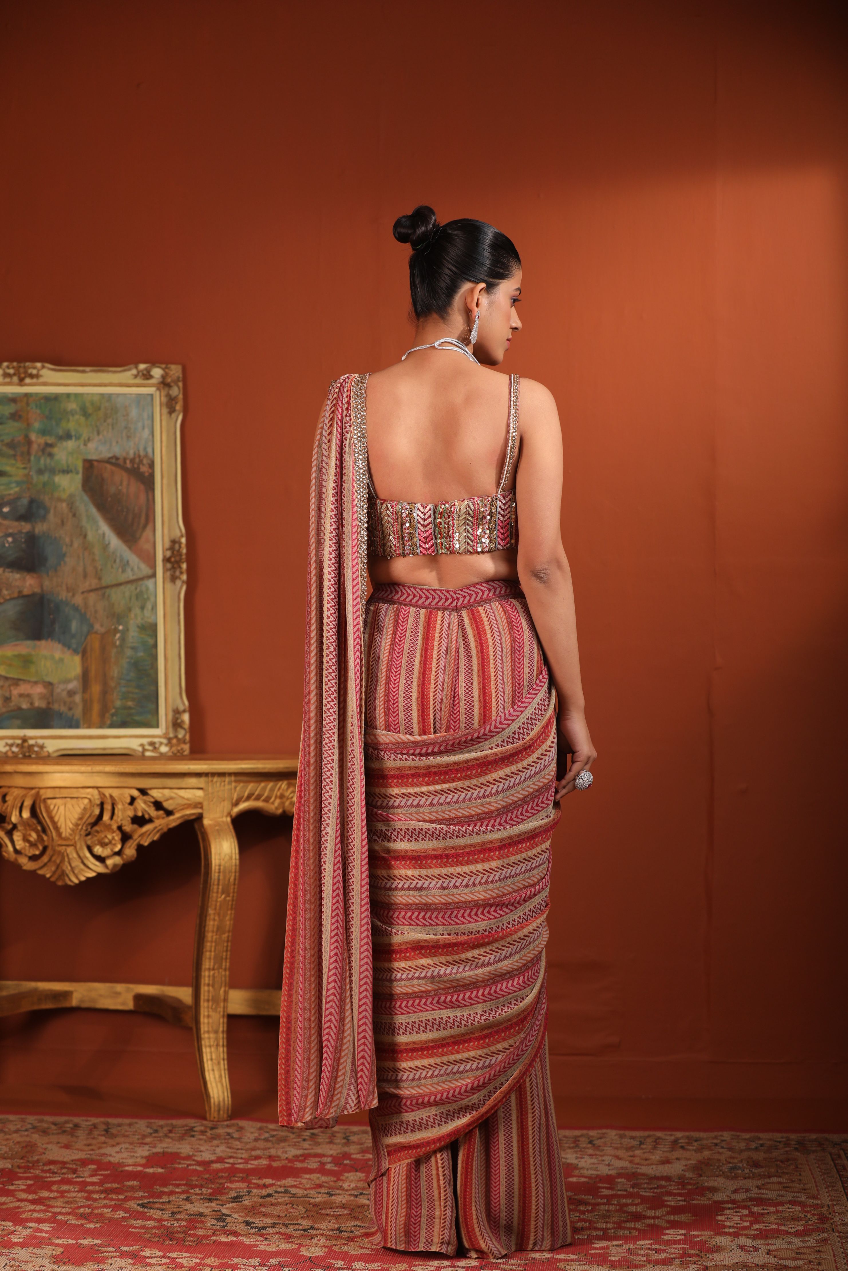 A model showcasing Predraped Saree by Mavish from Mavish's collection