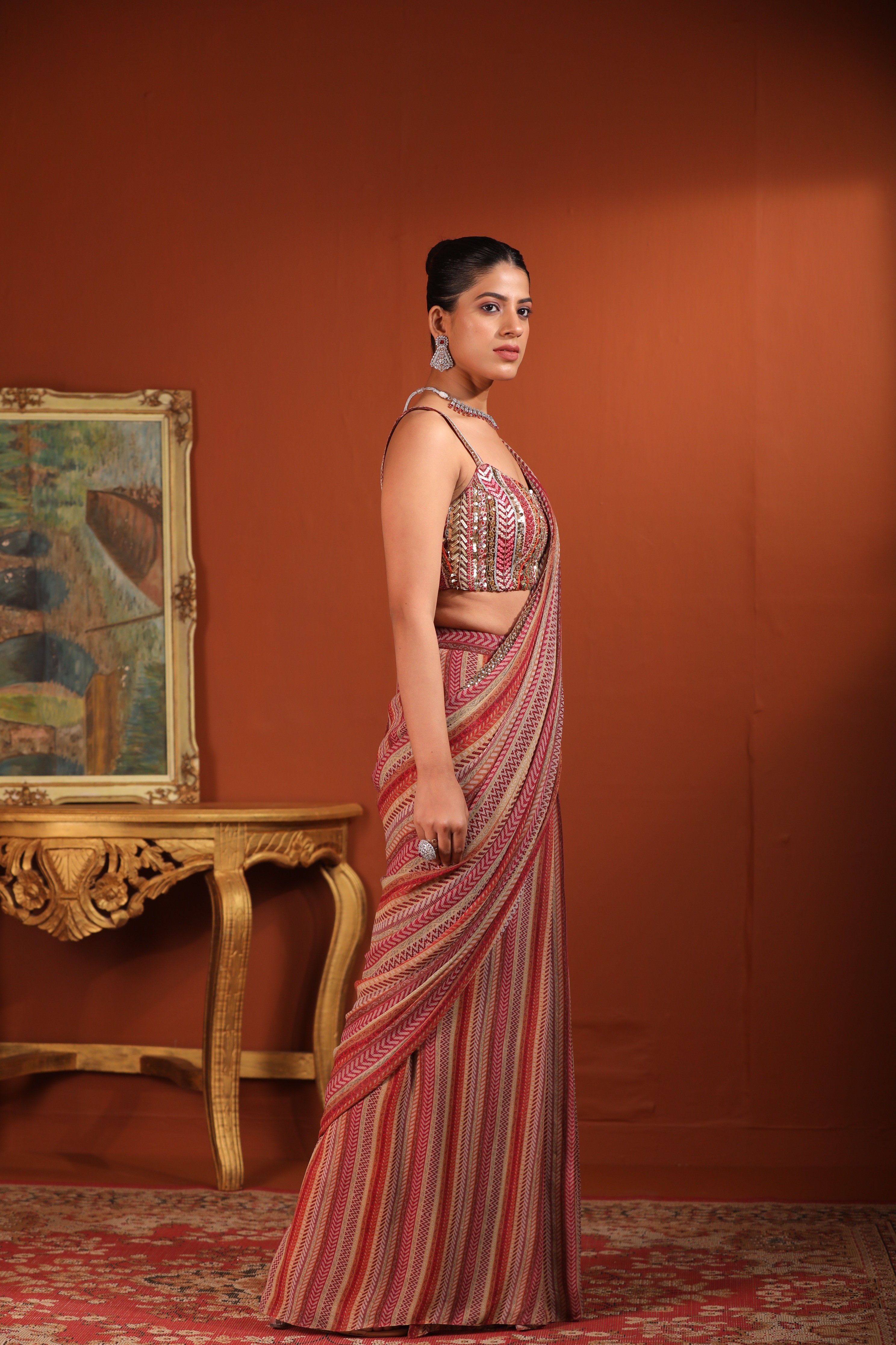 A model showcasing Predraped Saree by Mavish from Mavish's collection