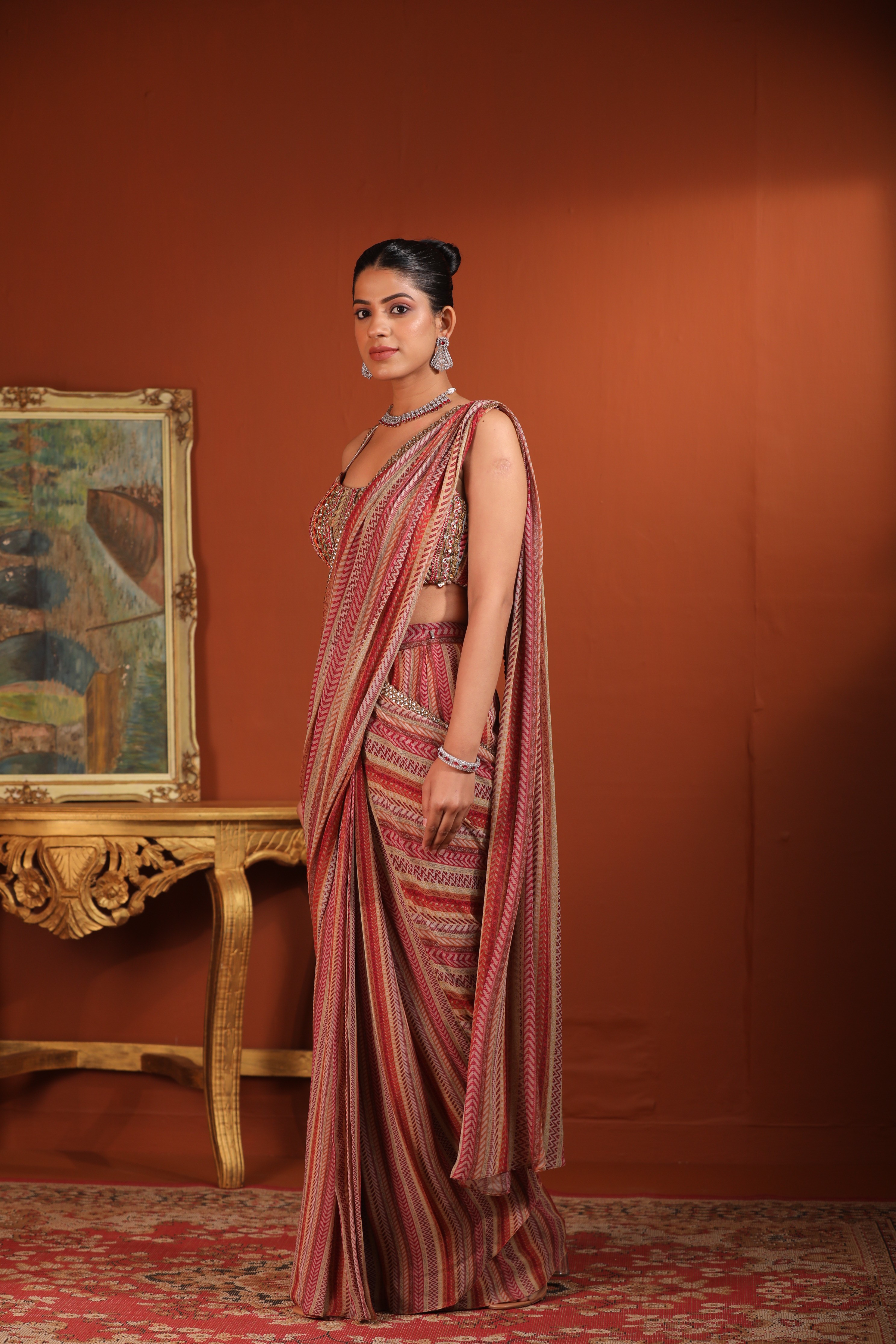 A model showcasing Predraped Saree by Mavish from Mavish's collection