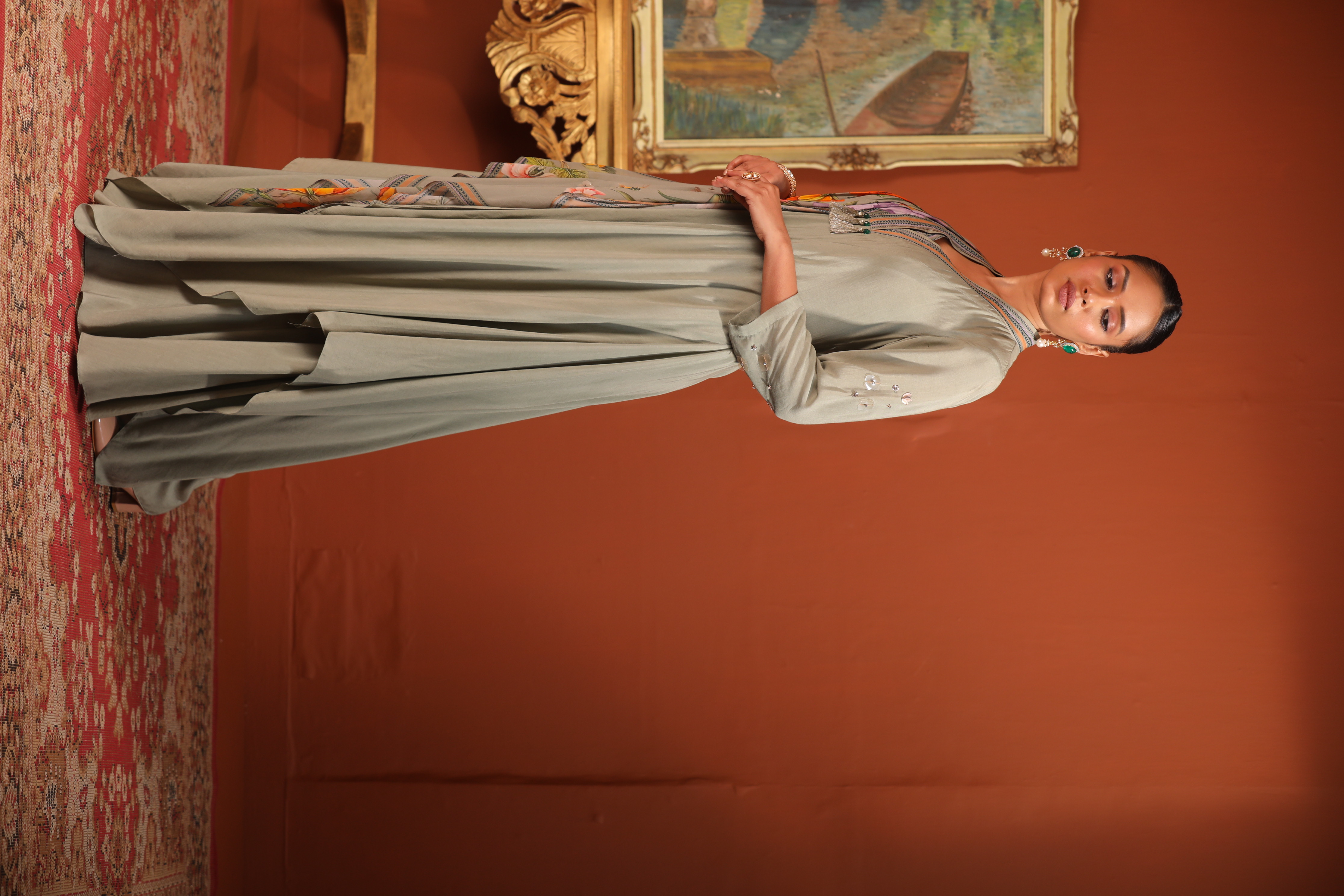 A model showcasing Green Layered Drape Anarkali by Mavish from Mavish's collection