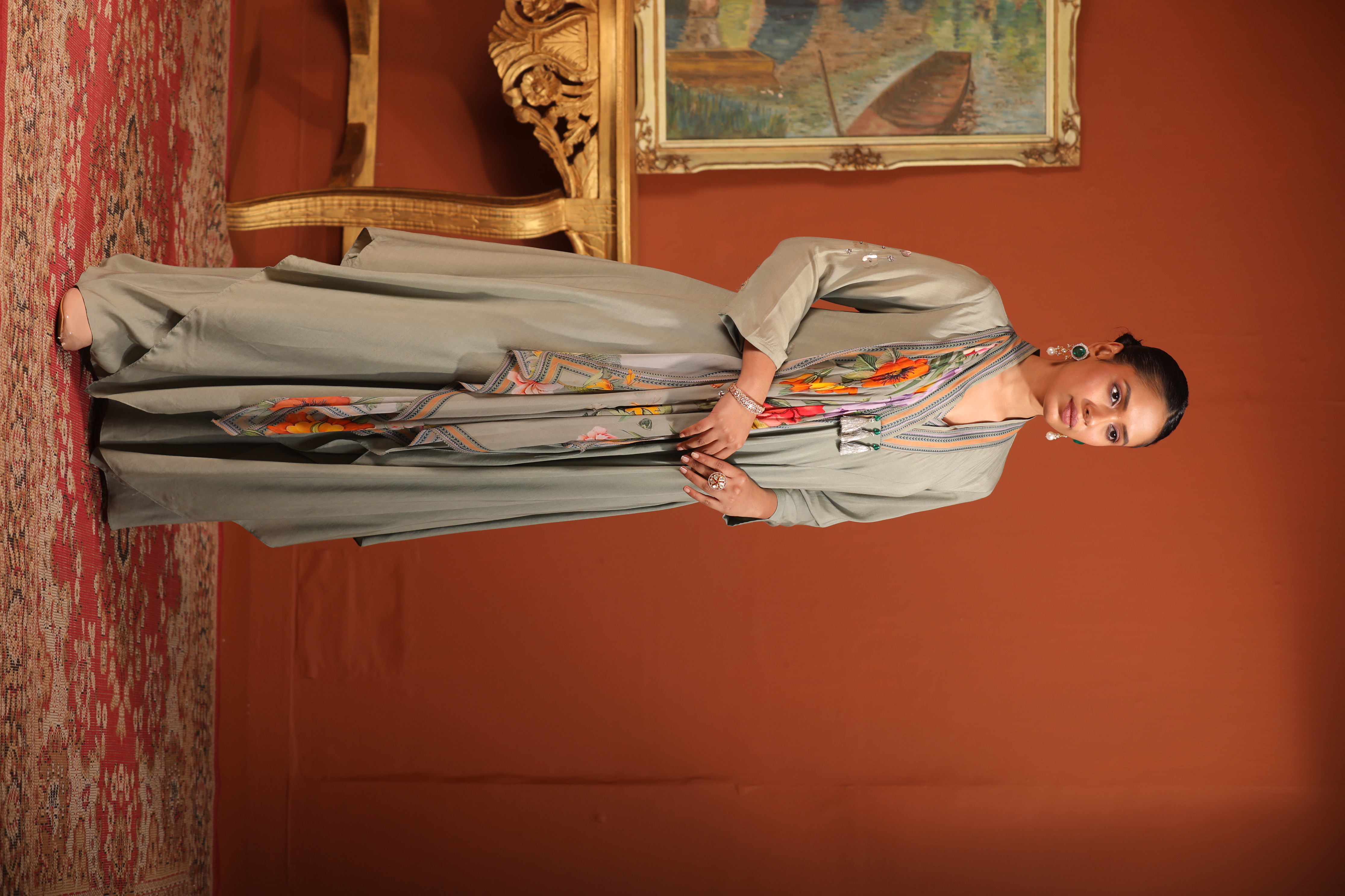 A model showcasing Green Layered Drape Anarkali by Mavish from Mavish's collection