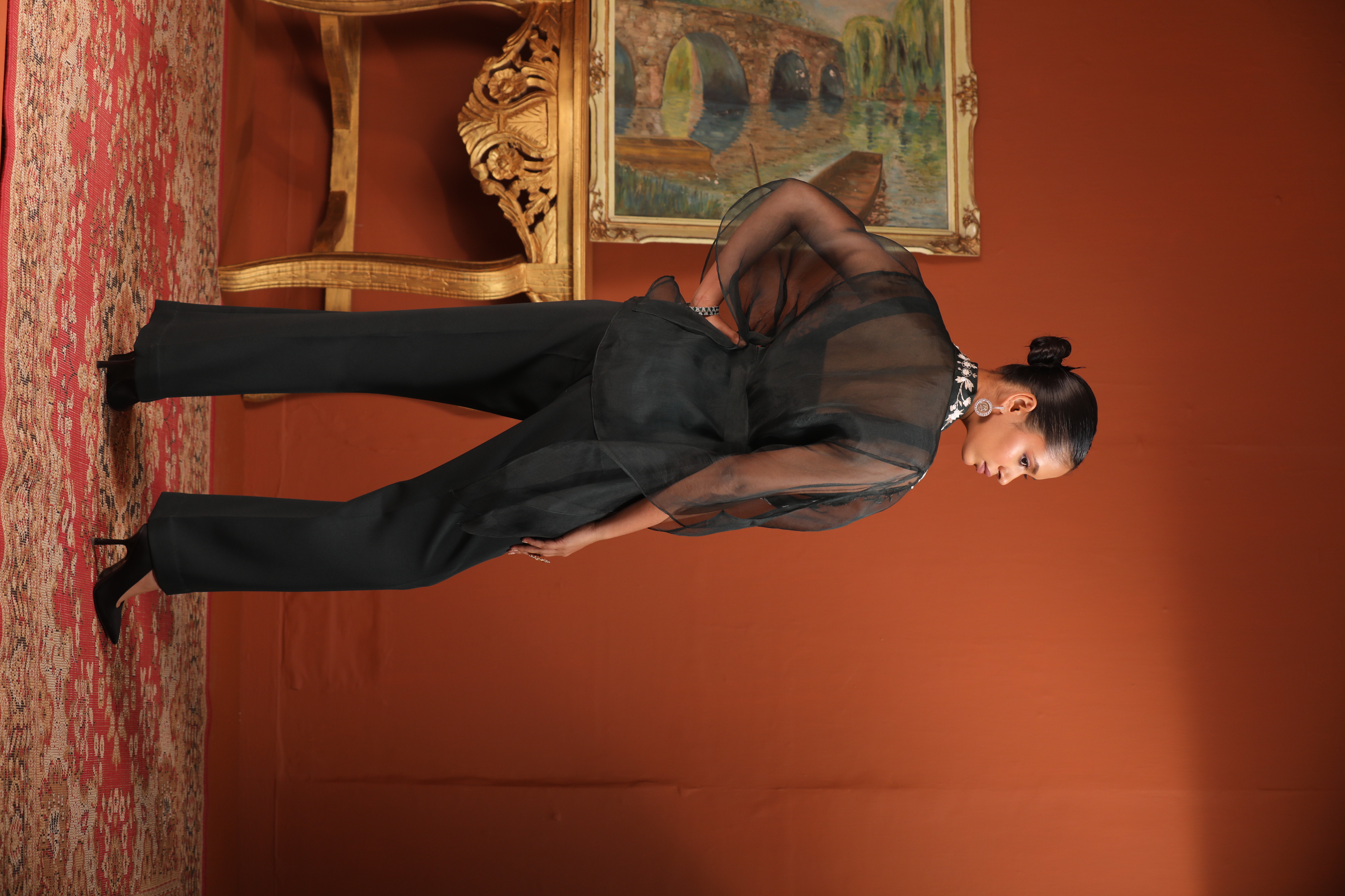A model showcasing Green Kaftan Top With Bustier Pants by Mavish from Mavish's collection